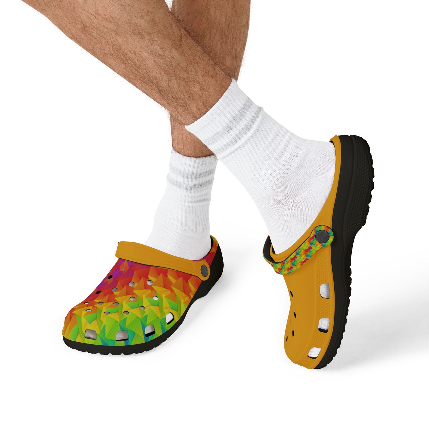 Ahi clogs worn with white socks, yellow upper with colorful print, black outsole.