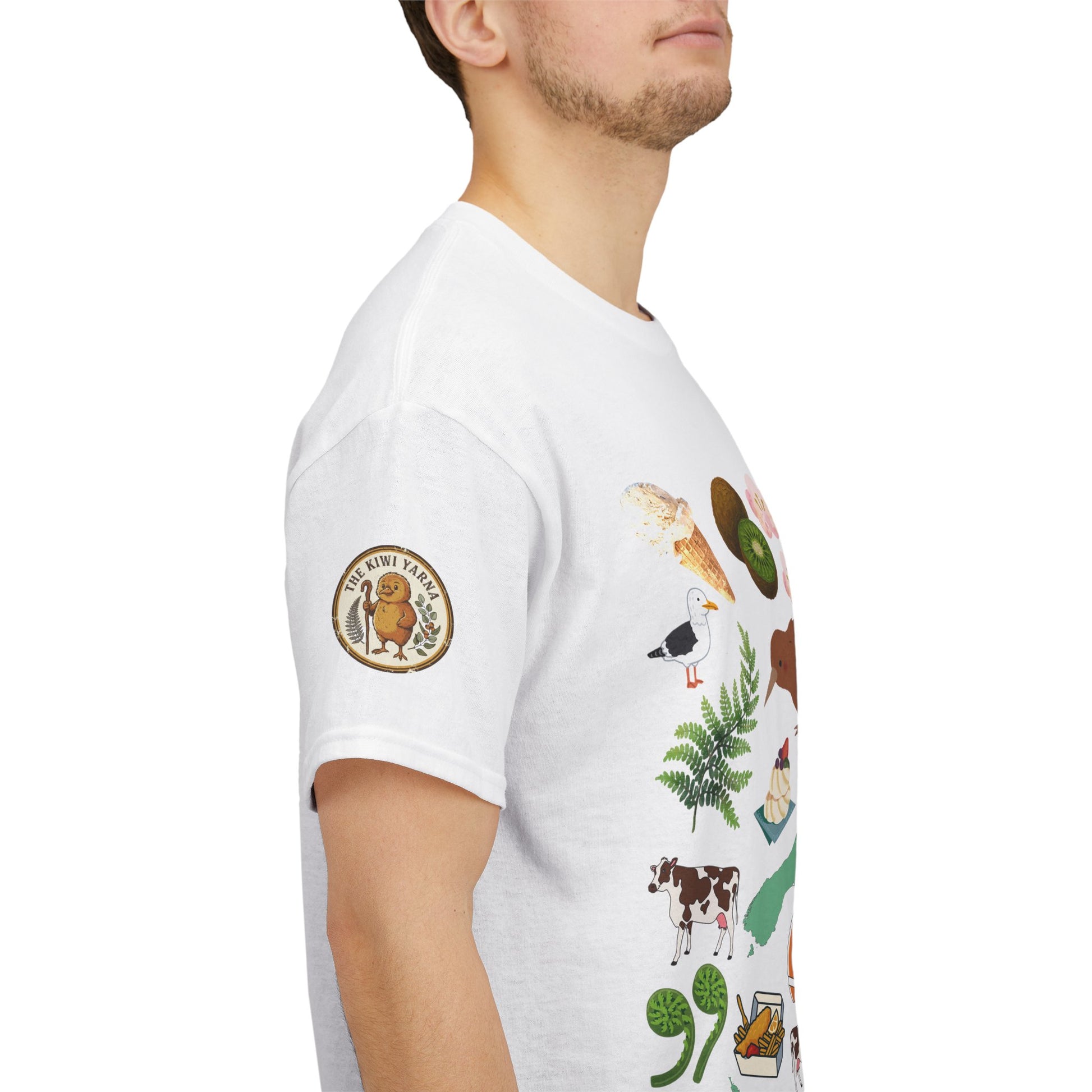 Kiwiana-inspired T-shirt, white with circular emblem and colorful wildlife/fern graphic on sleeve