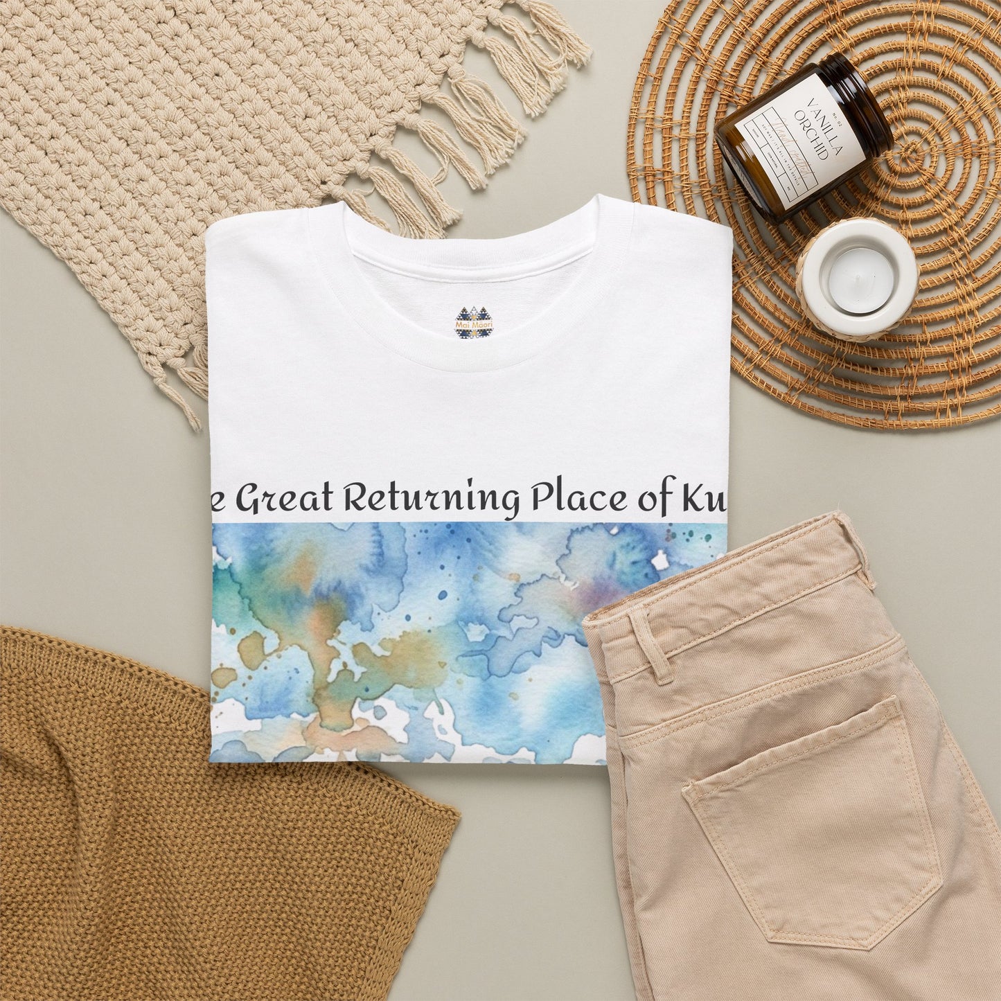 White crew-neck T-shirt with partial watercolor landscape print and small collar emblem