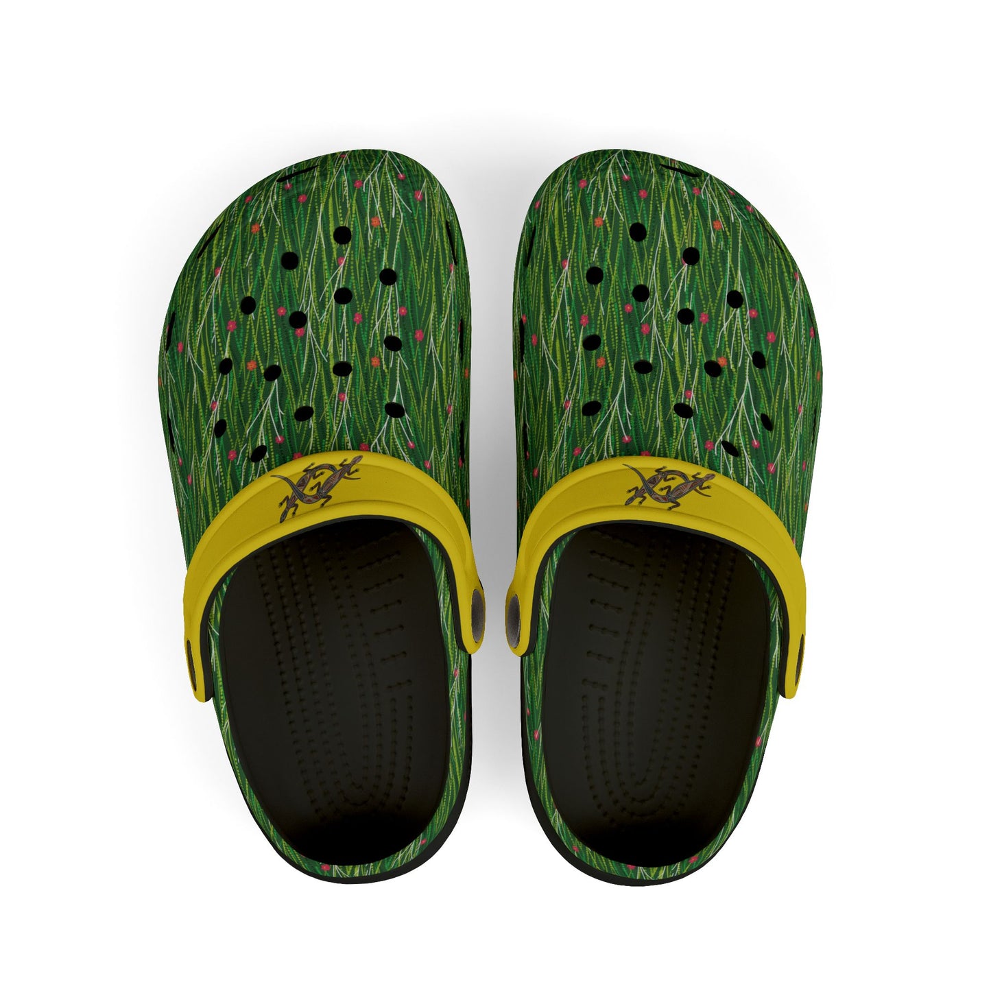 Pair of green patterned clogs with yellow strap and black interior holes