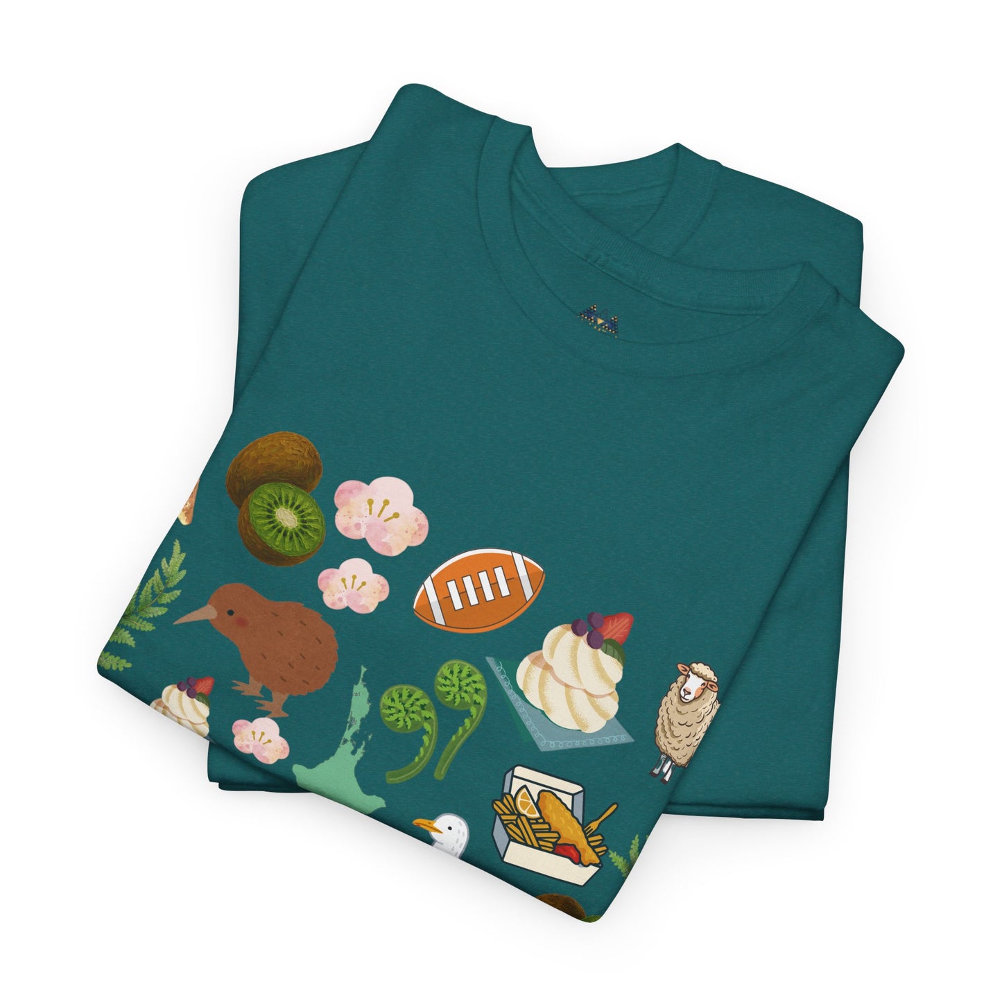 Teal crewneck T-shirt folded flat with colorful Kiwiana-themed animals and fruit (front)