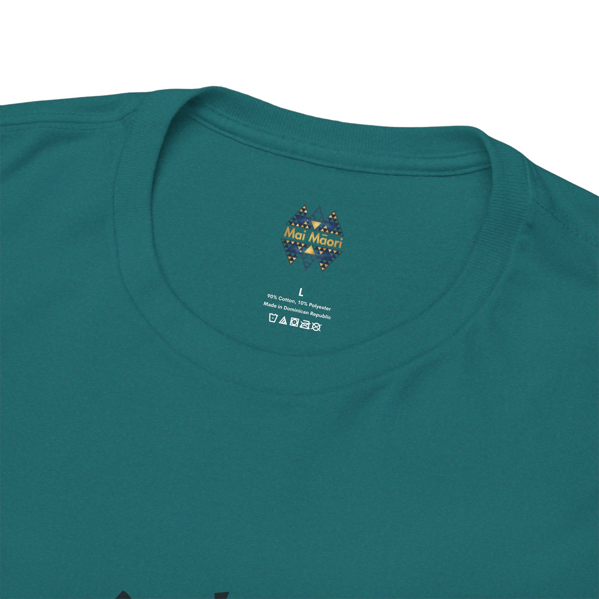 Close-up of teal T-shirt crewneck; small brand mark on upper chest
