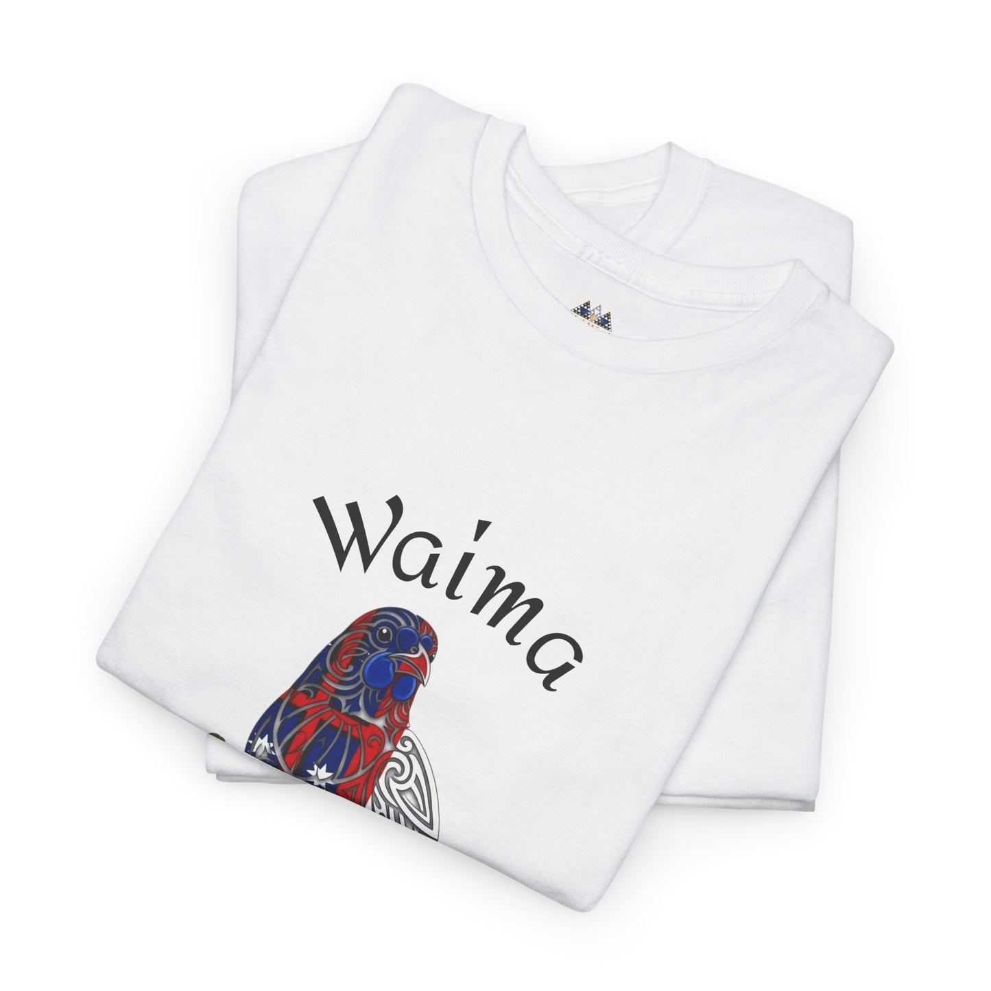 White graphic T-shirt folded with bird illustration and “Waima” text