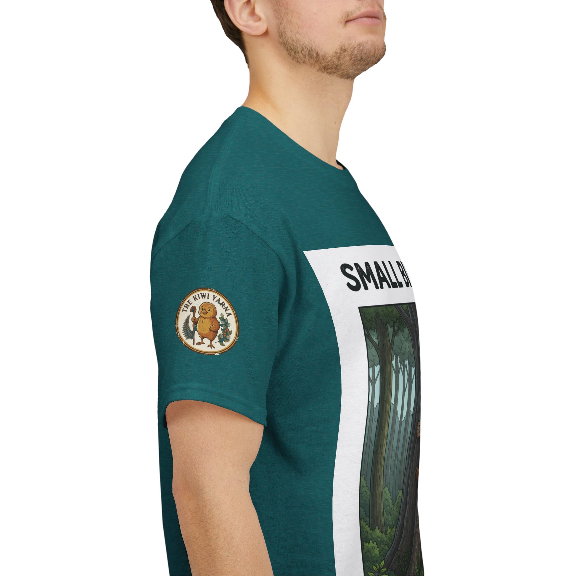Teal short-sleeve T-shirt with circular logo and forest graphic sleeve