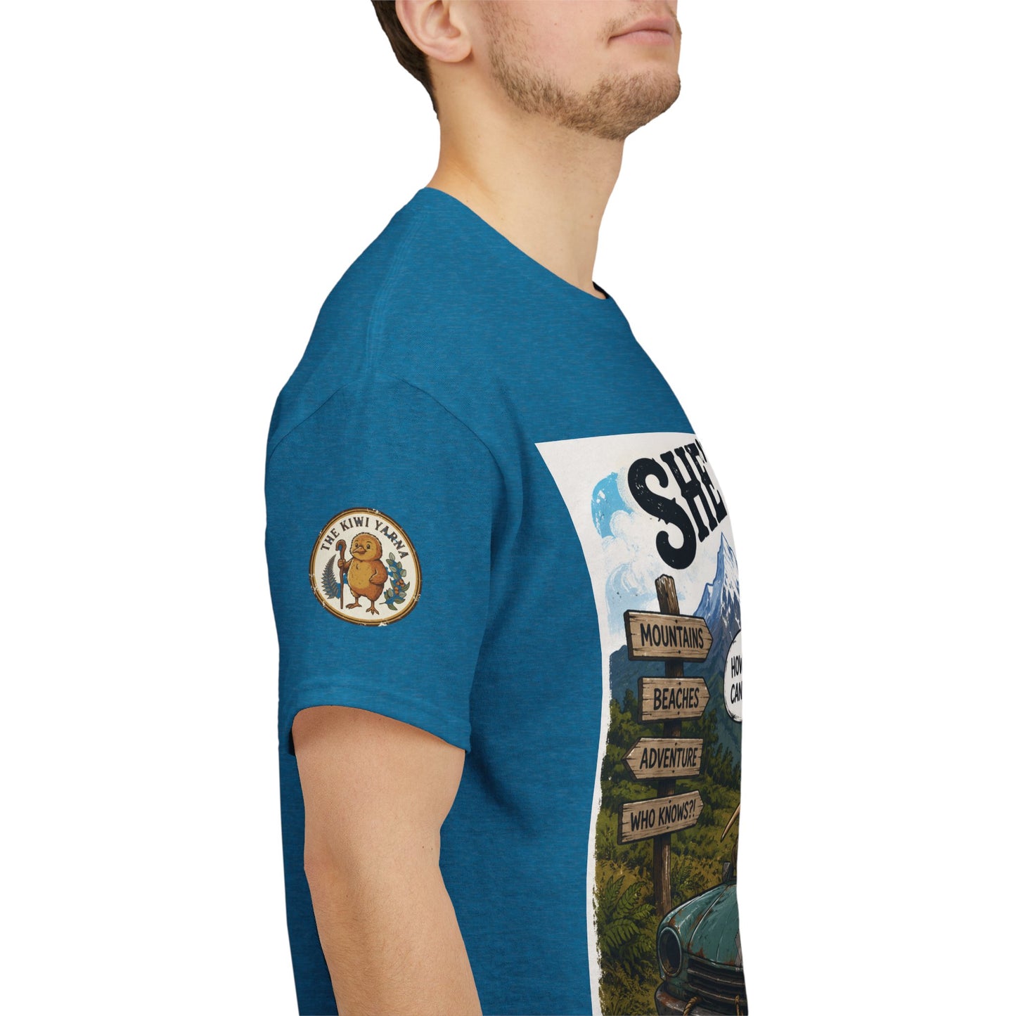 Teal graphic T-shirt with circular emblem patch and side view vehicle print
