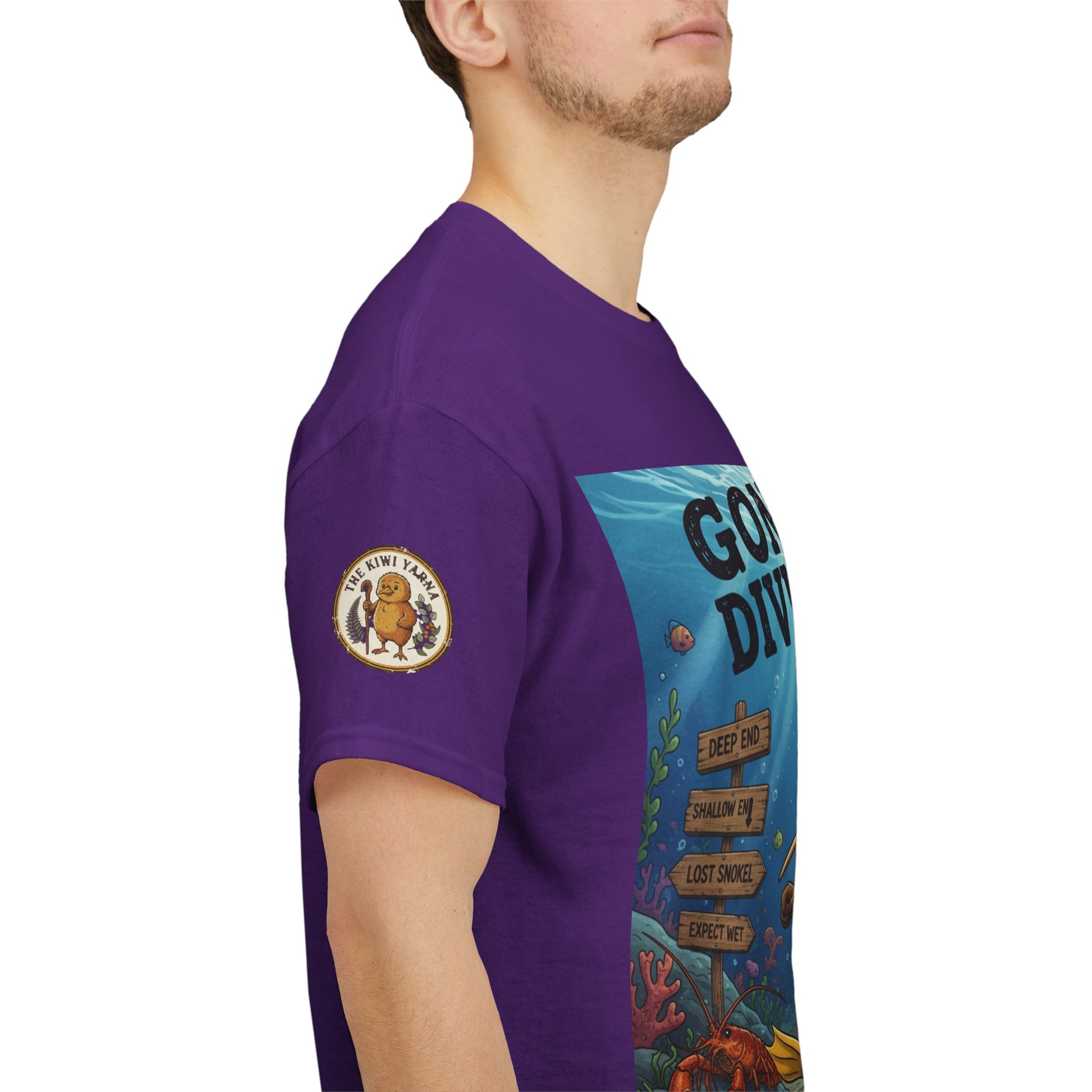 Purple T-shirt side view with circular sleeve emblem and diver graphic panel