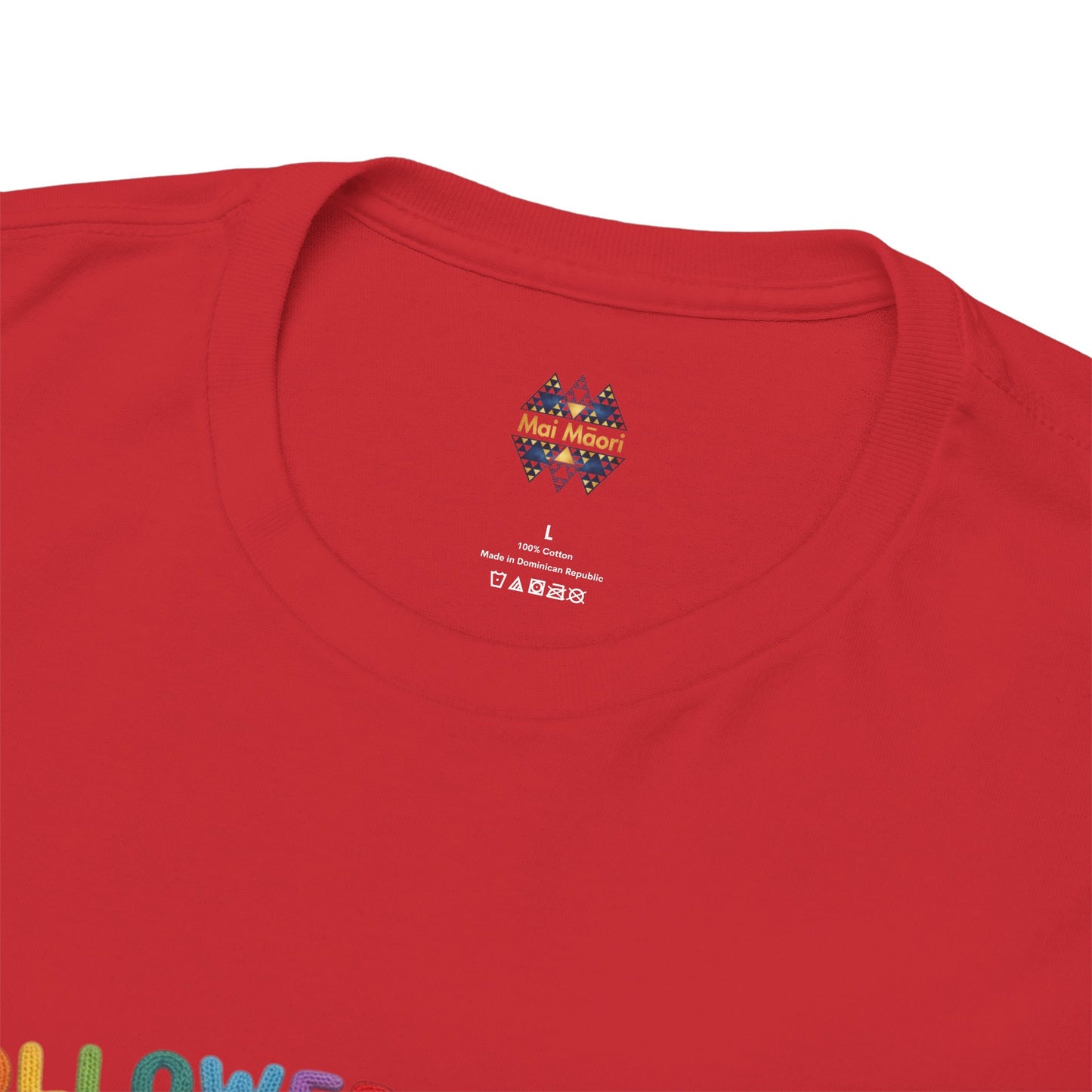 Red t-shirt neckline with small crest logo and printed label near the collar.