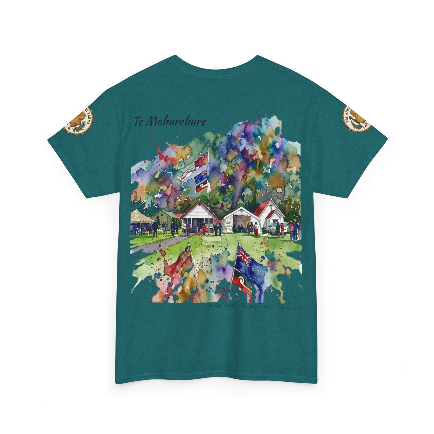 Teal crew-neck T-shirt with colorful village scene graphic and small sleeve emblems