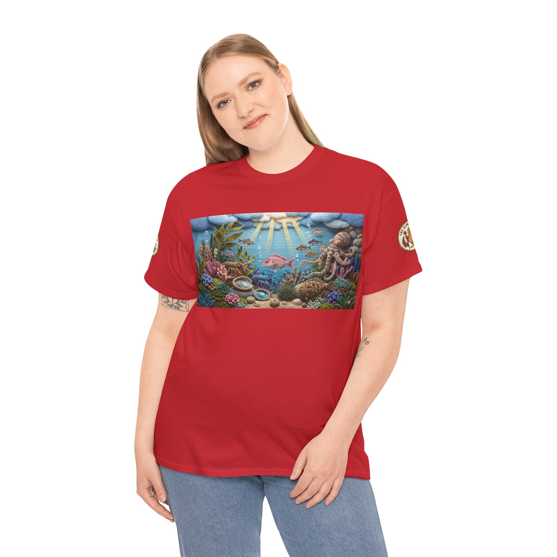 Red T-shirt worn by model with rectangular underwater sea-life print panel at center chest.