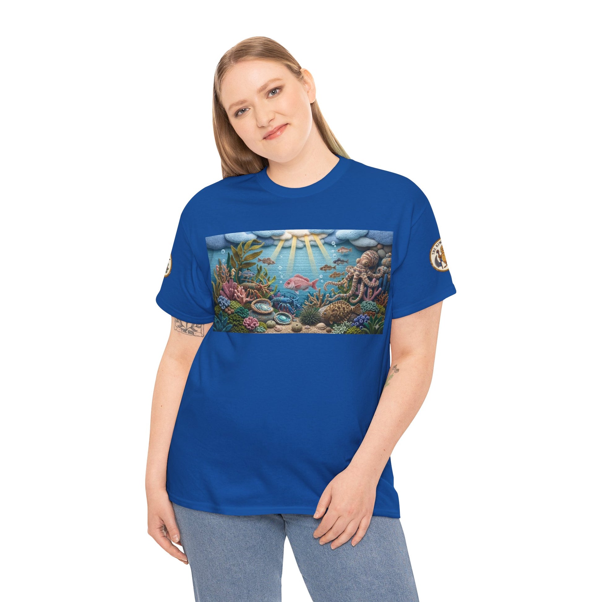 Blue crewneck T-shirt with rectangular undersea graphic panel and circular sleeve patches
