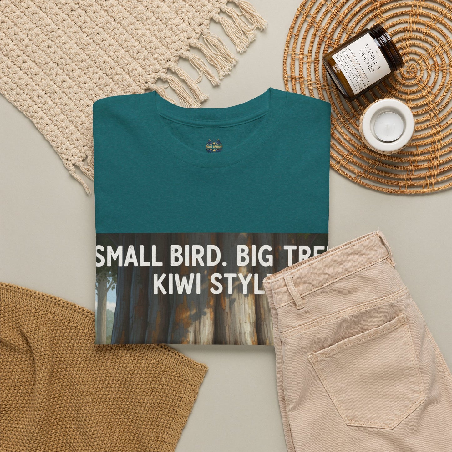 Teal graphic T-shirt with front woodland print and “Small Bird, Big Tree” text
