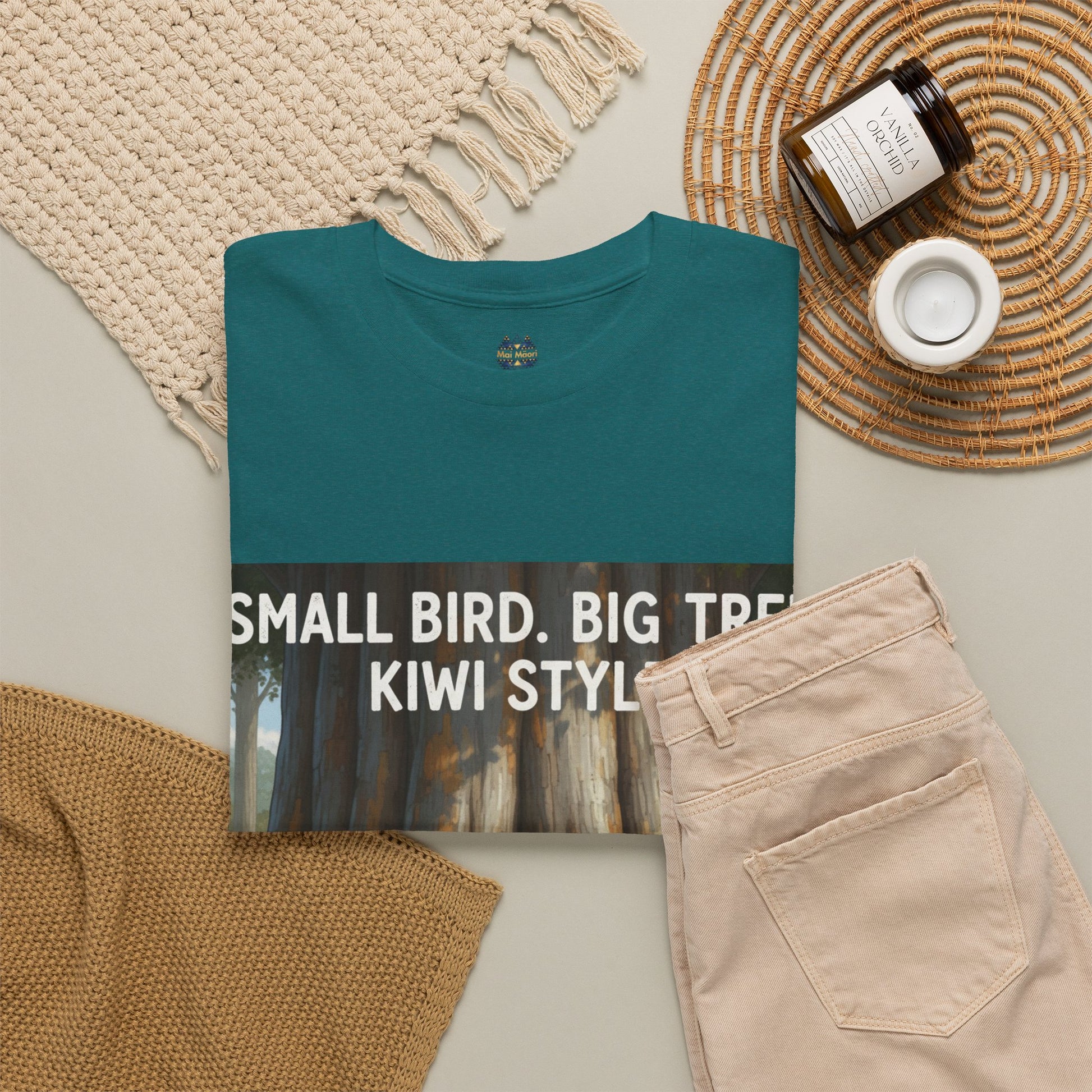 Teal graphic T-shirt with front woodland print and “Small Bird, Big Tree” text