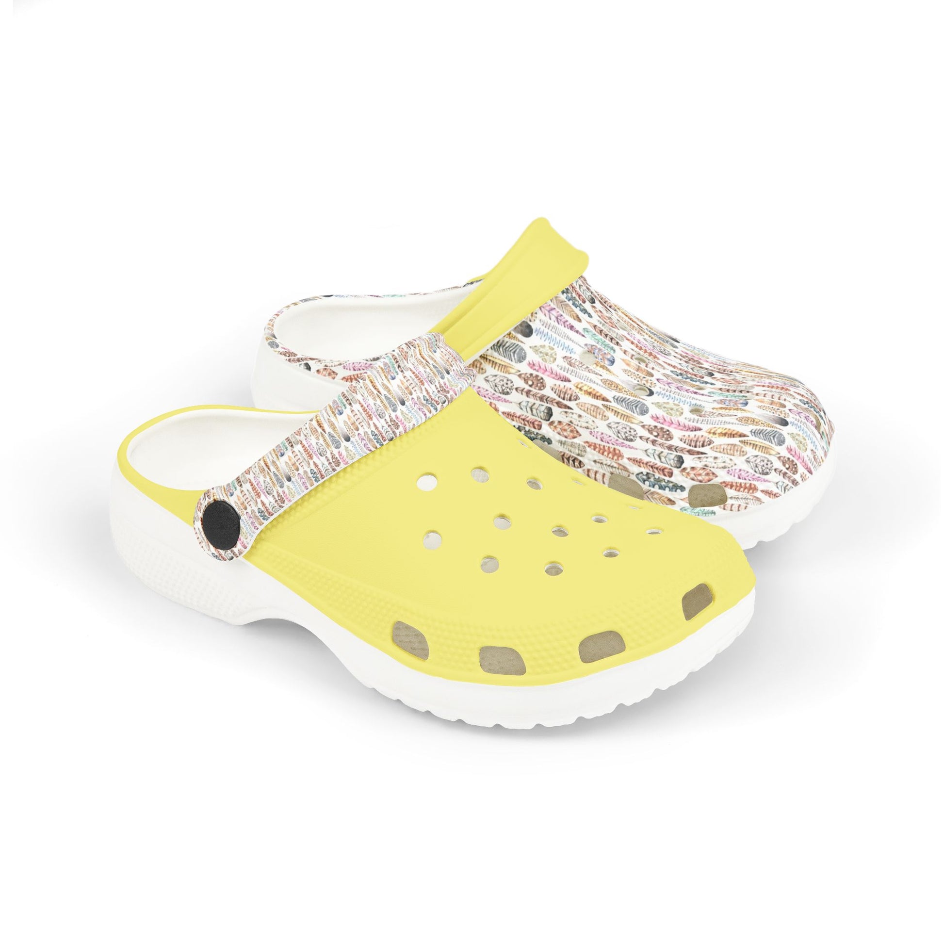 Croc-style clogs with white patterned upper, yellow back strap, and dotted toe panel
