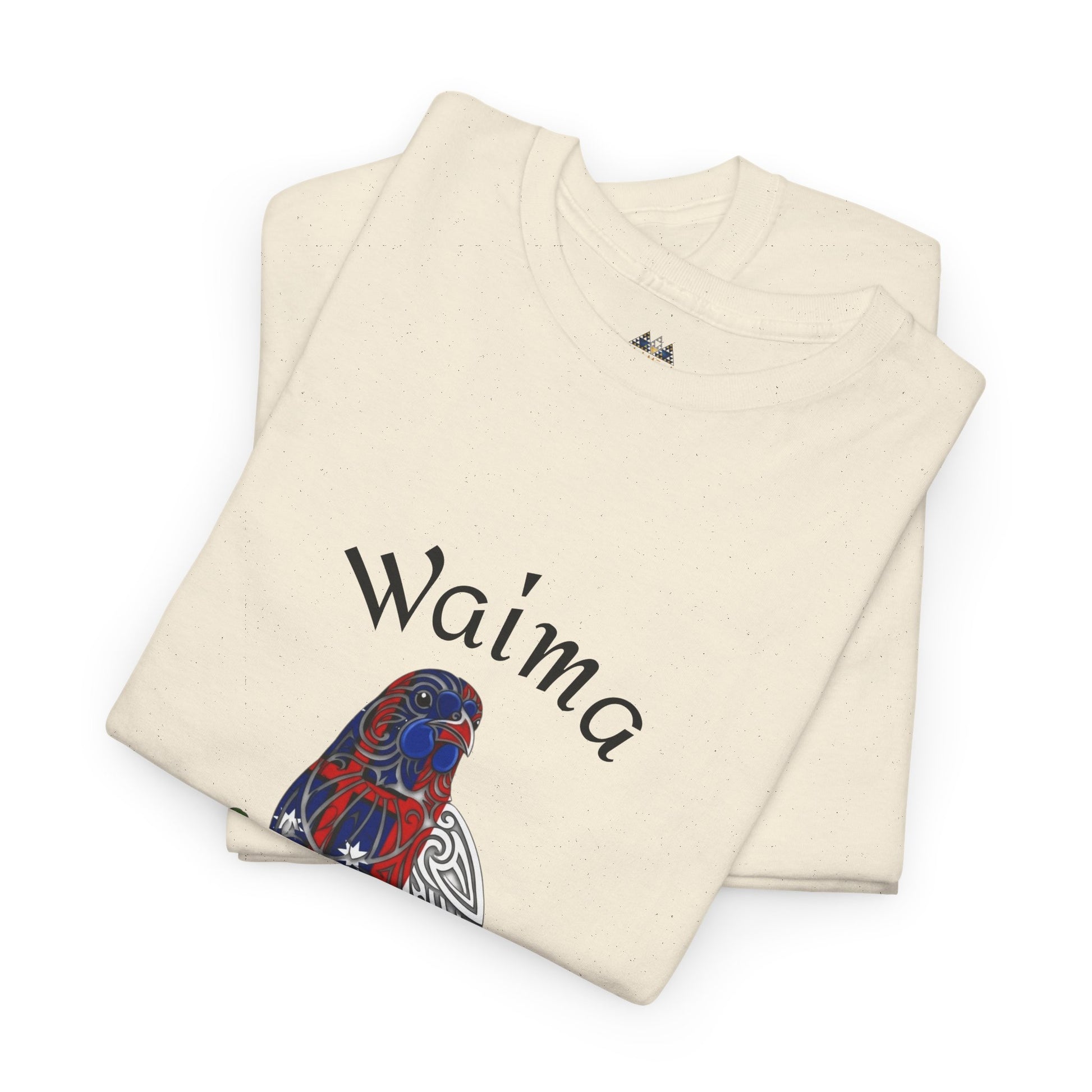 Cream graphic T-shirt folded with Waima bird print on front