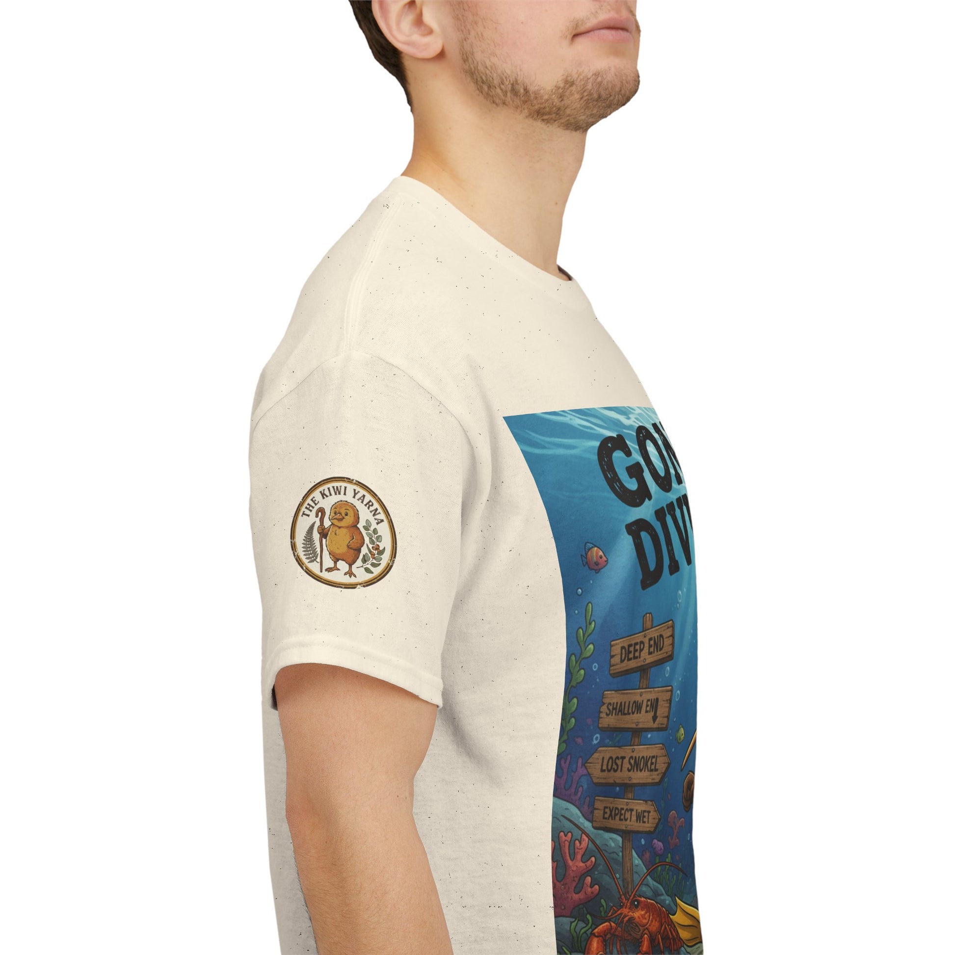 Cream graphic t-shirt sleeve with circular emblem and 'GONE DIVING' panel