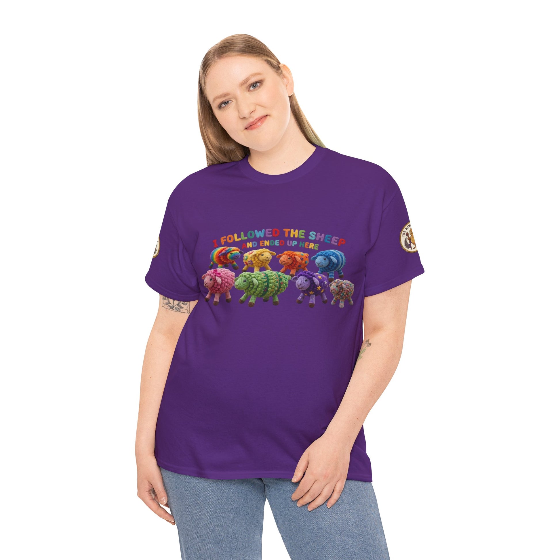 Purple graphic crewneck t-shirt worn by model, with colorful sheep print across chest.