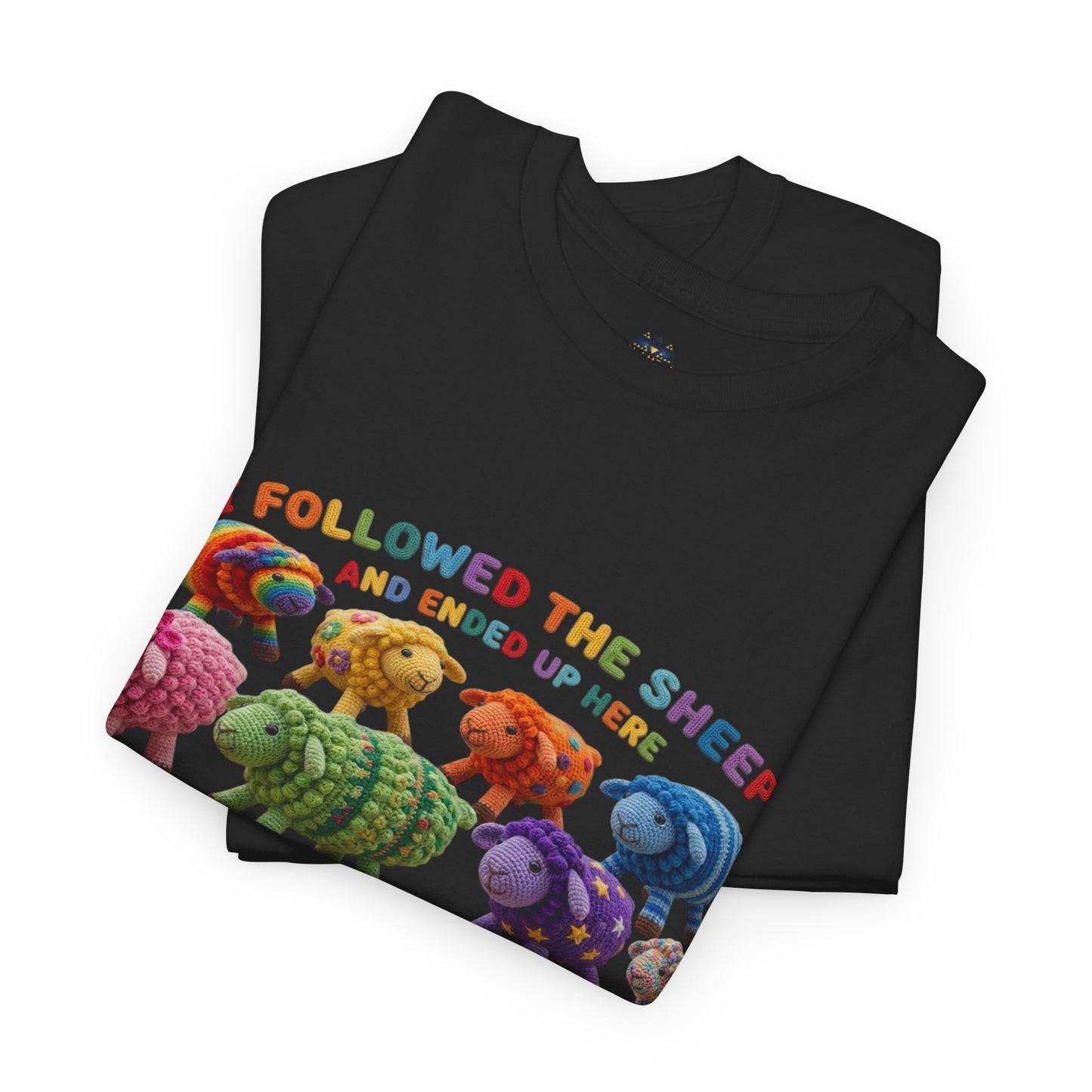 Black T-shirt folded with colorful sheep graphic across the front