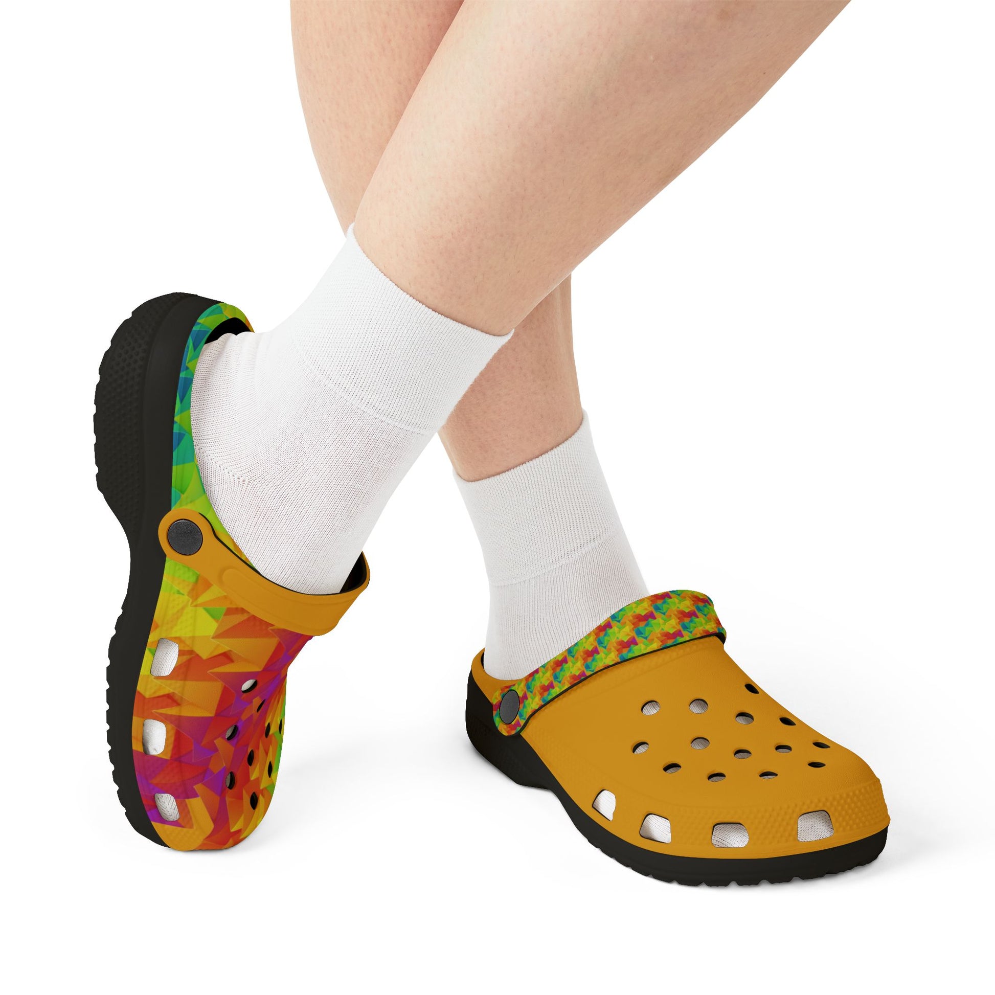 Ahi clogs worn with white socks, black and yellow pair with geometric print, perforated toe.