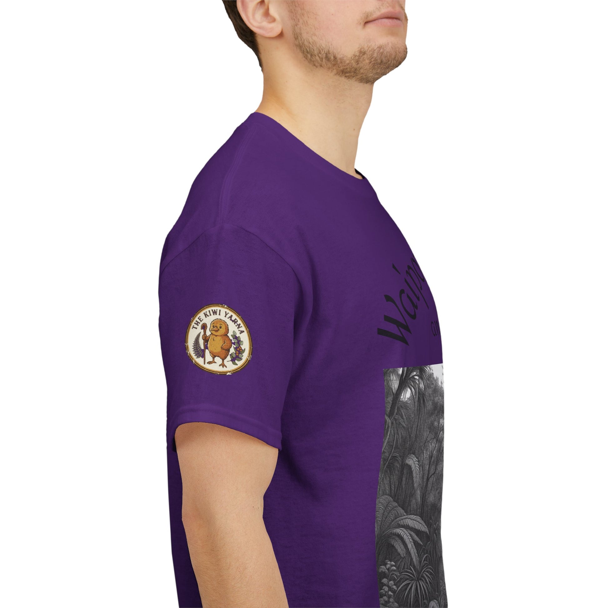 Purple T-shirt side view with circular sleeve emblem and monochrome forest graphic