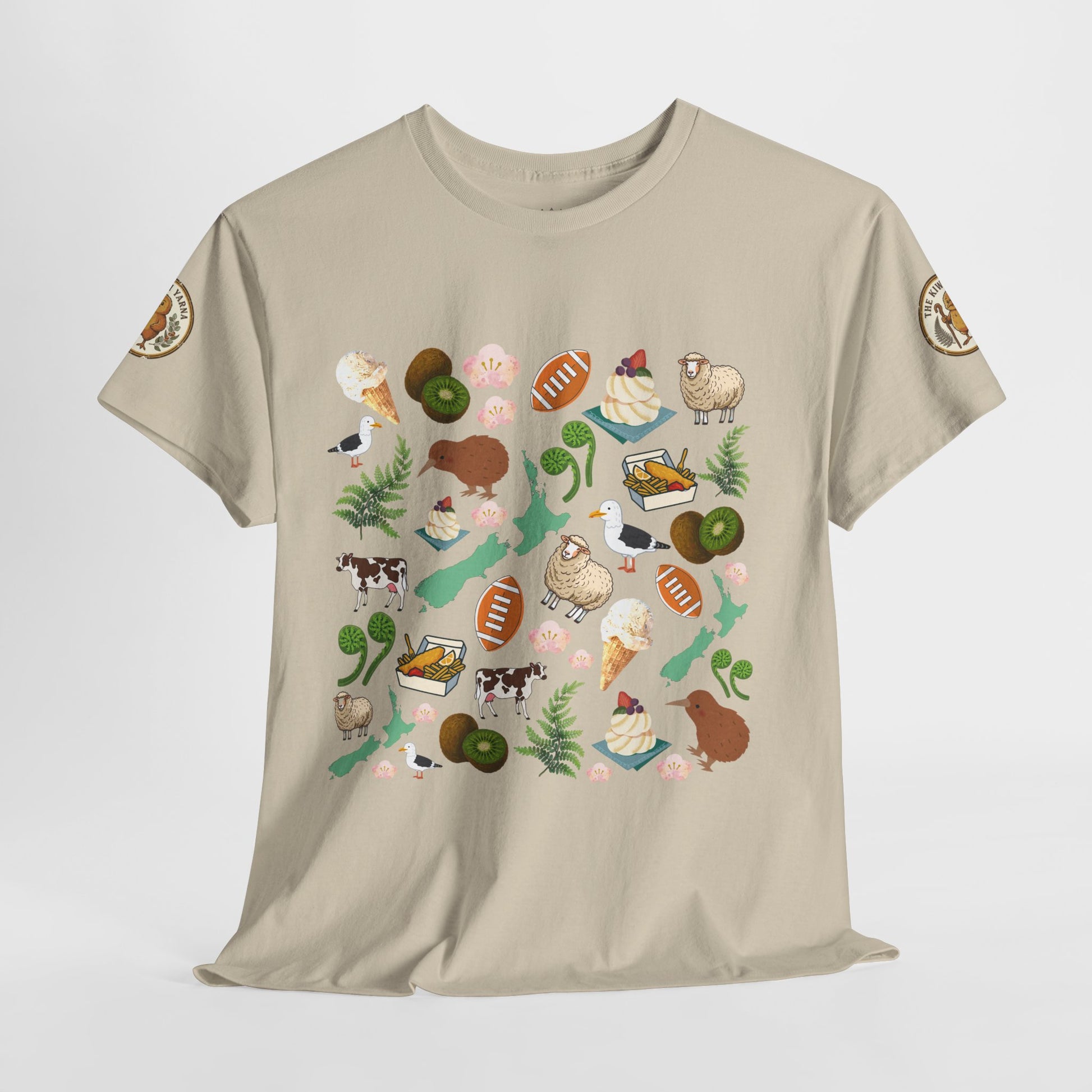 Beige crewneck T-shirt with colorful Kiwiana collage print and sleeve badges