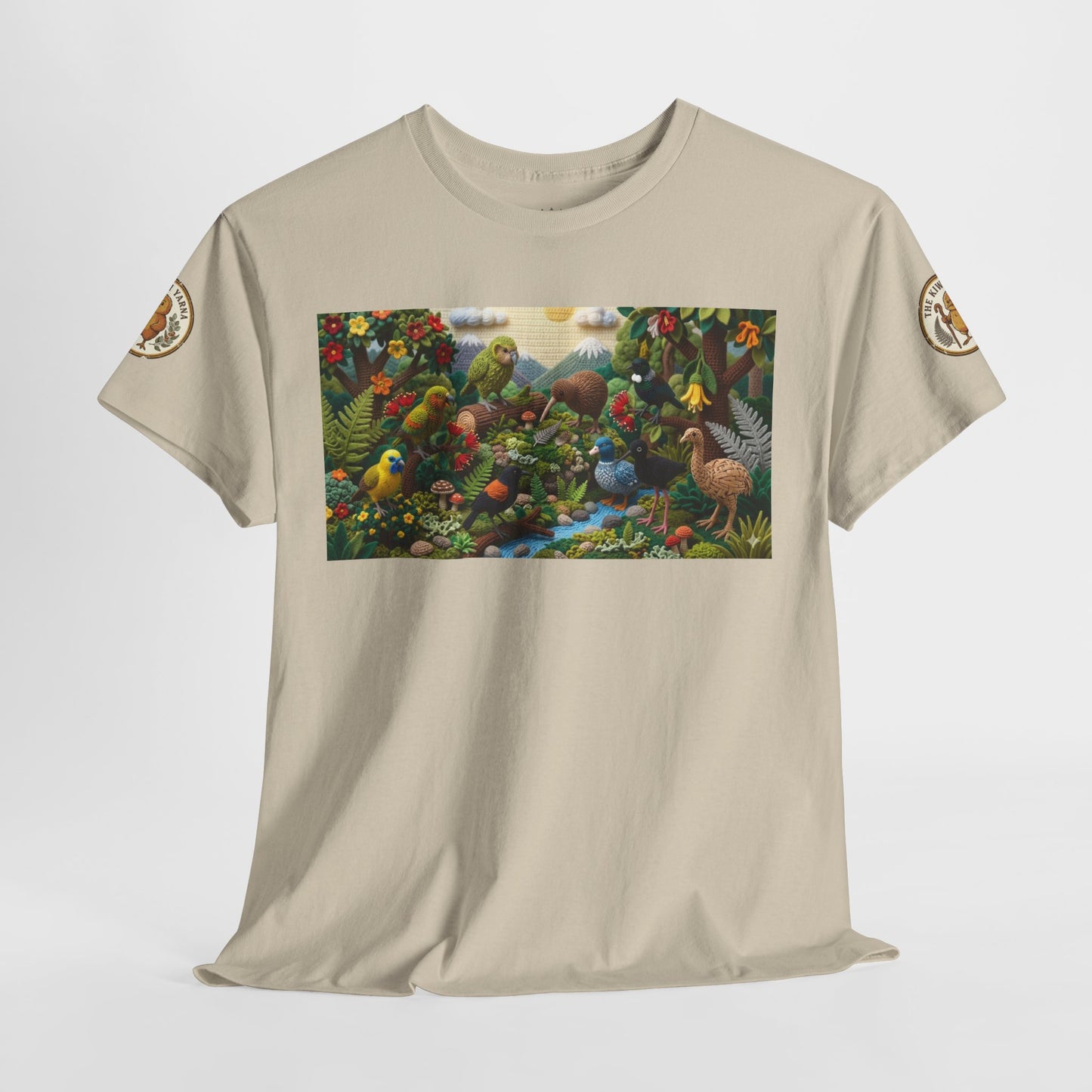 Sand crew-neck T-shirt front view with rectangular birds-and-forest graphic and sleeve patches.