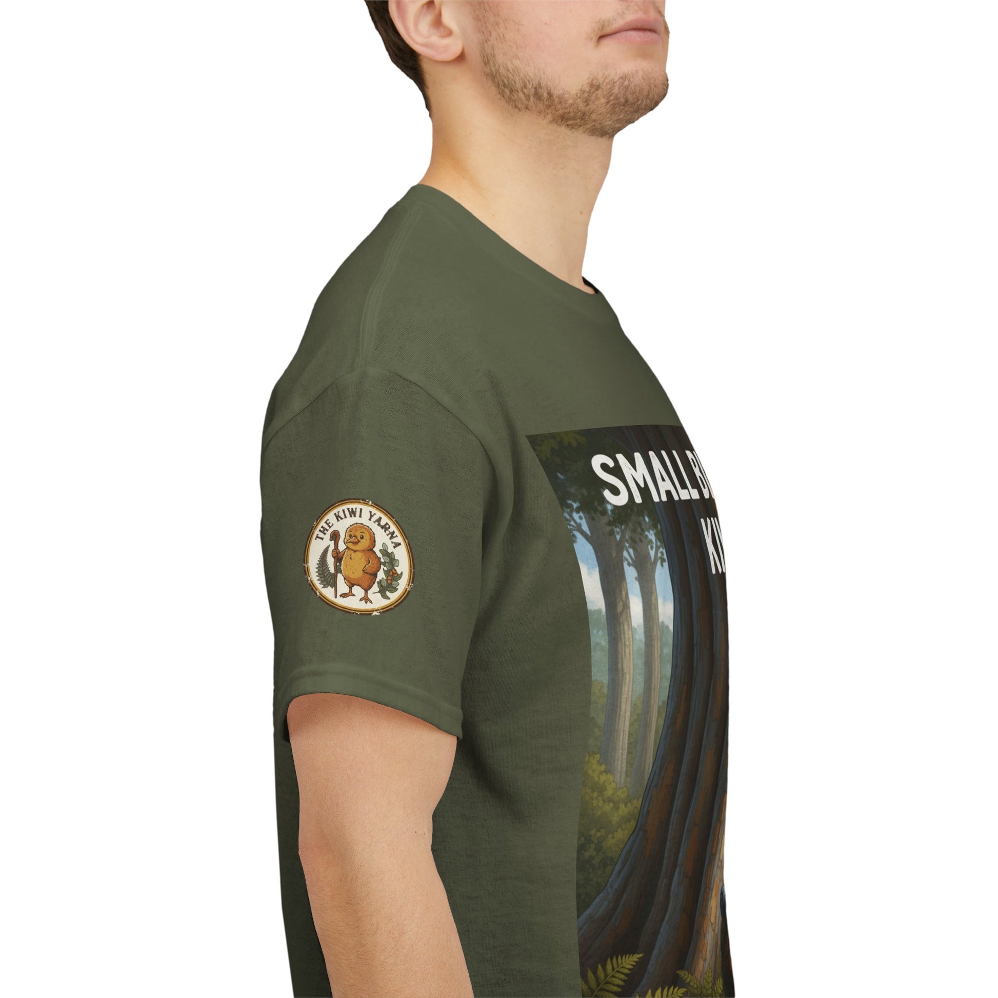 Forest green T-shirt side view with round sleeve emblem and jungle graphic