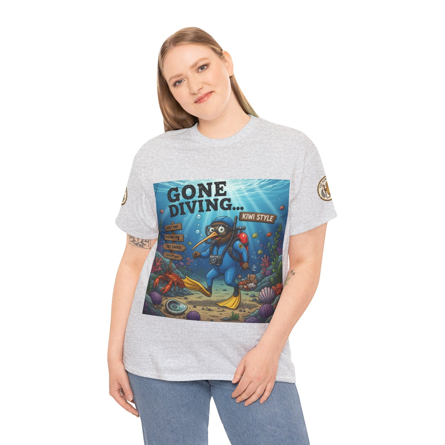Light gray crew-neck T-shirt worn by model with 'Gone Diving... Kiwi Style' graphic print