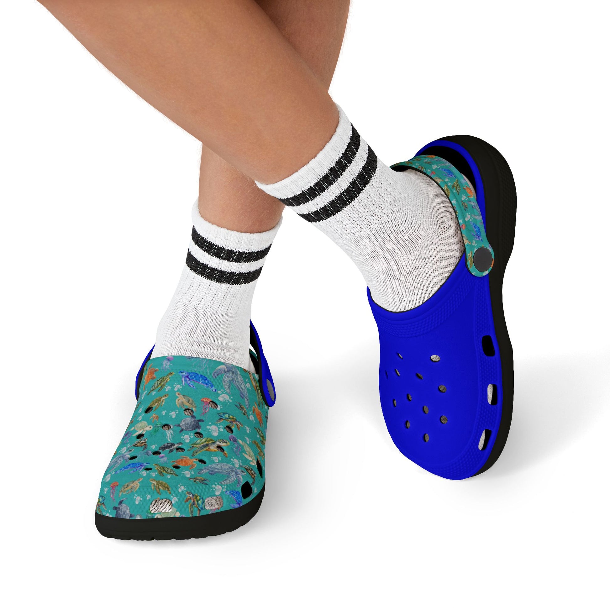 Kids' clogs with white striped socks; blue upper, teal sea-animal print, black sole.