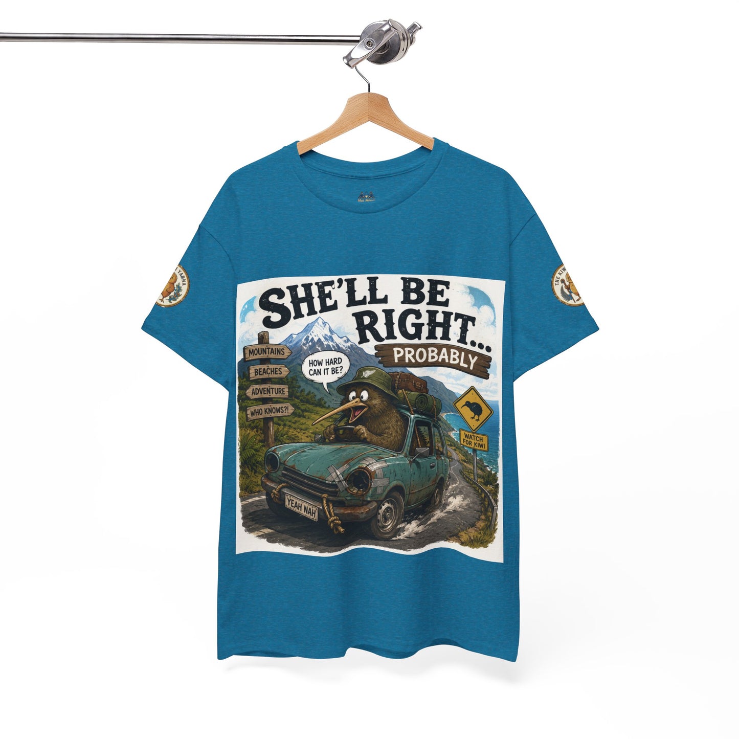 Teal graphic T-shirt on hanger with 'She'll Be Right... Probably' vehicle print