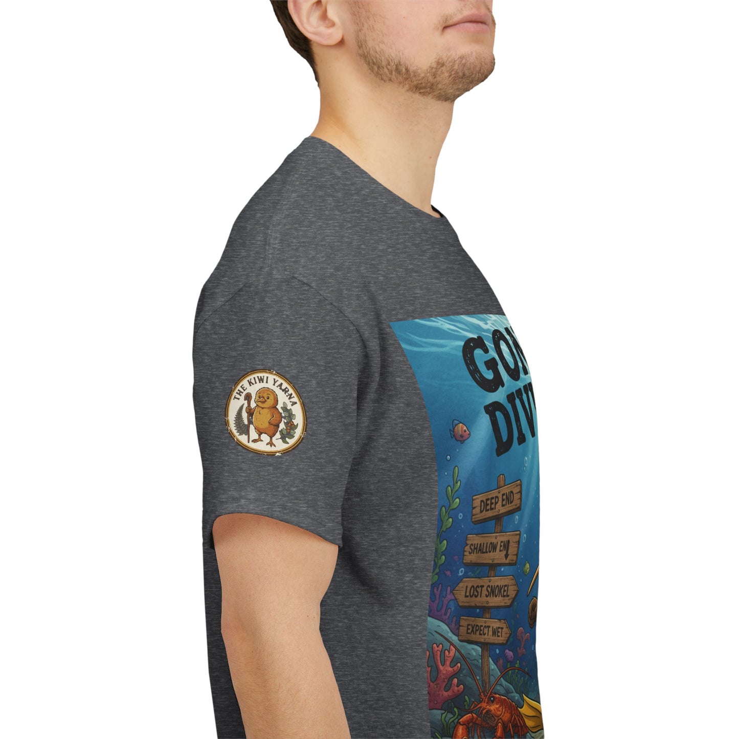Gray T-shirt side view with gold circular logo patch on sleeve