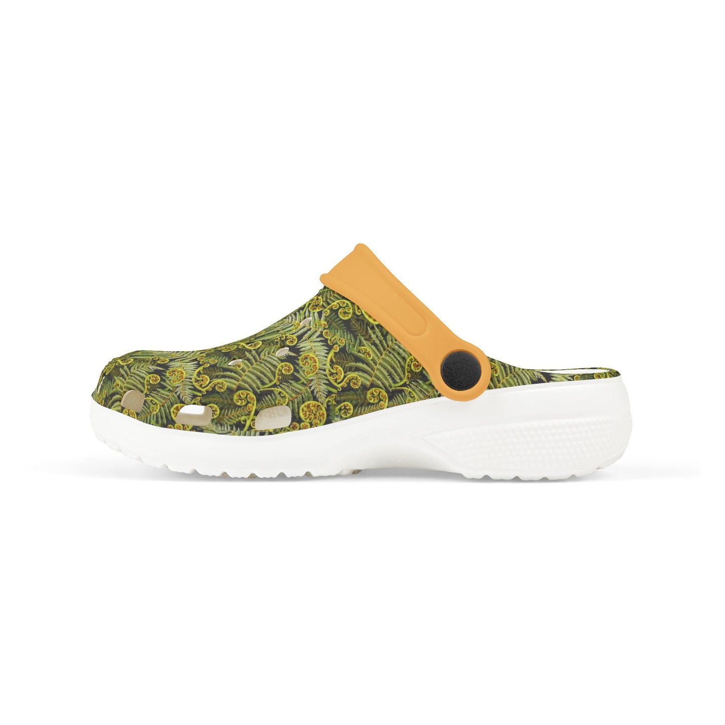 Low-profile slip-on clogs with green patterned upper, tan top panel, and white sole