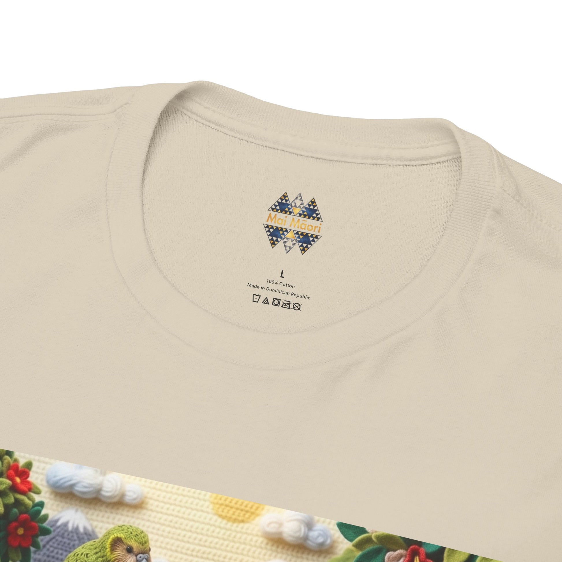 Sand T-shirt back neck area with small logo patch near the collar seam.