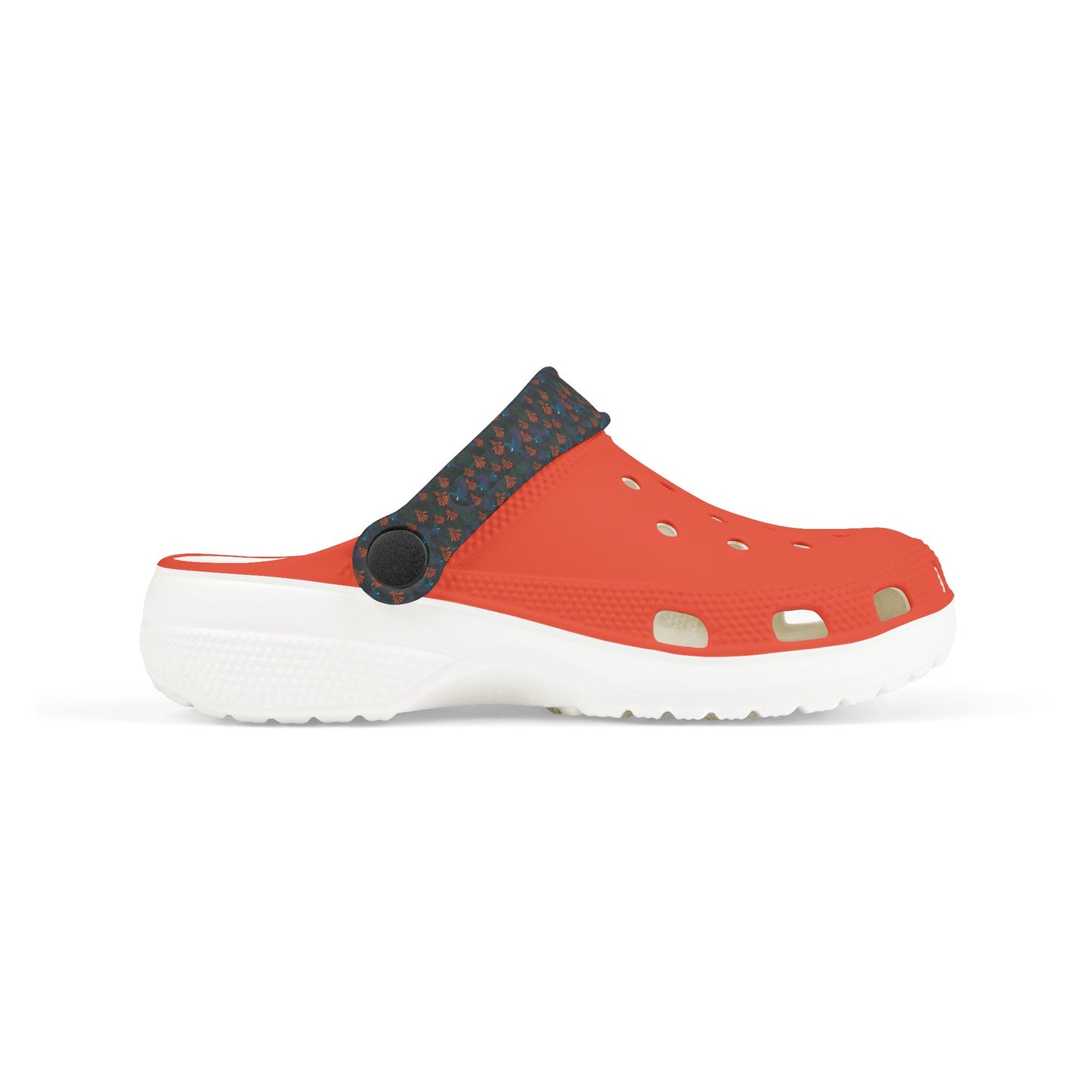Kids clog shoe with orange front and dark floral upper, round strap, vent holes, white sole