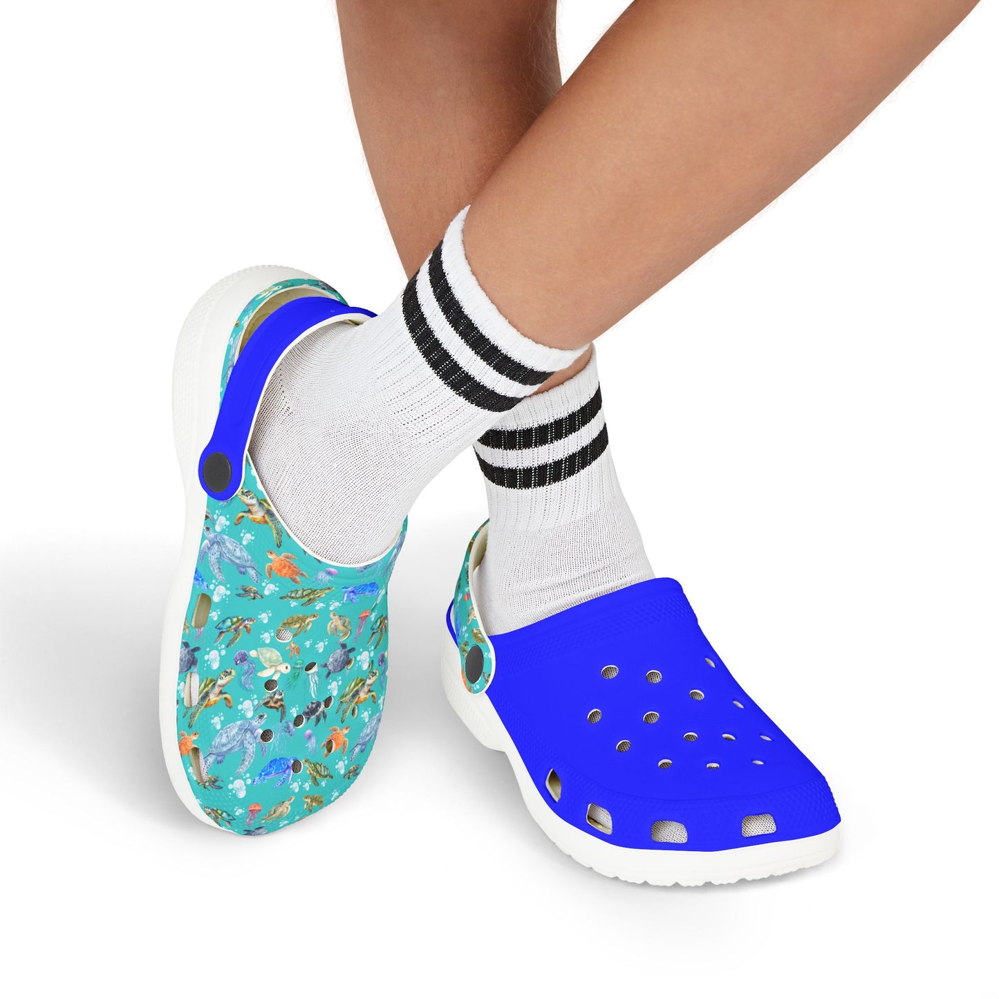 Pair of kids slip-on clogs worn with striped socks: teal print inset and blue top