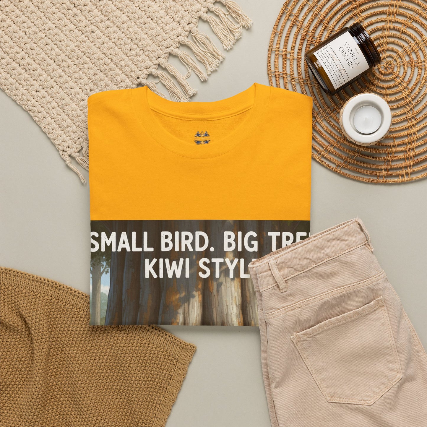 Bright yellow crew-neck t-shirt with large forest graphic, paired with casual clothes