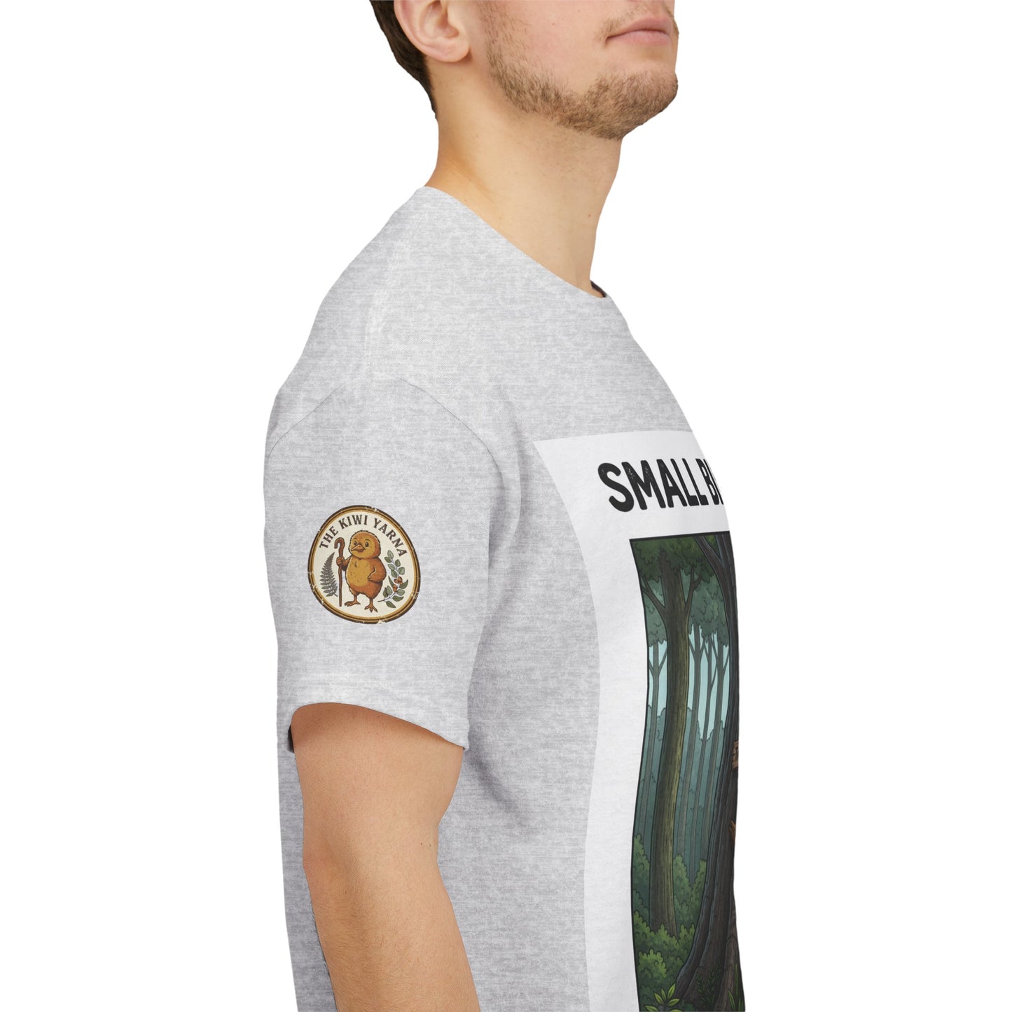 Heather gray T-shirt with side sleeve patch logo and partial forest graphic