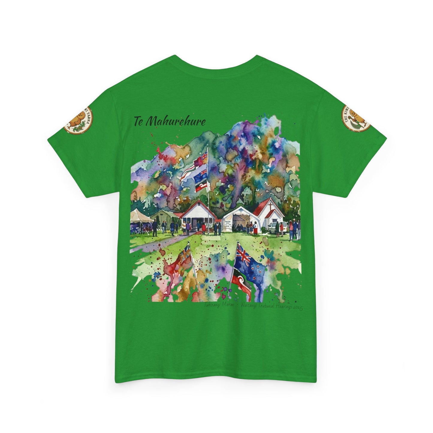 Green T-shirt with colorful splash-style village scene graphic and left sleeve patch