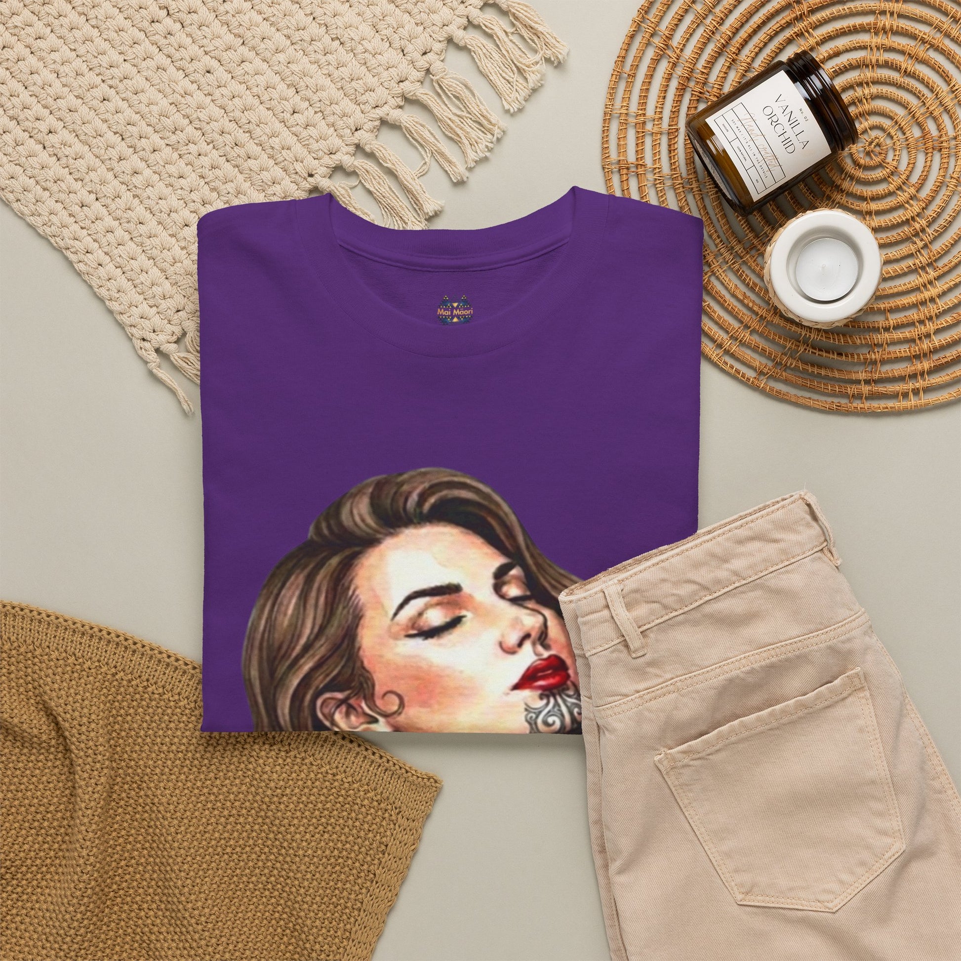 Purple graphic T-shirt laid flat, showing back portrait print and crew neckline.