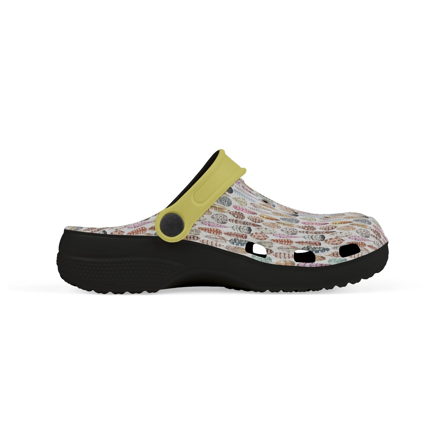 Croc-style clogs with white patterned upper, yellow strap, and black platform sole