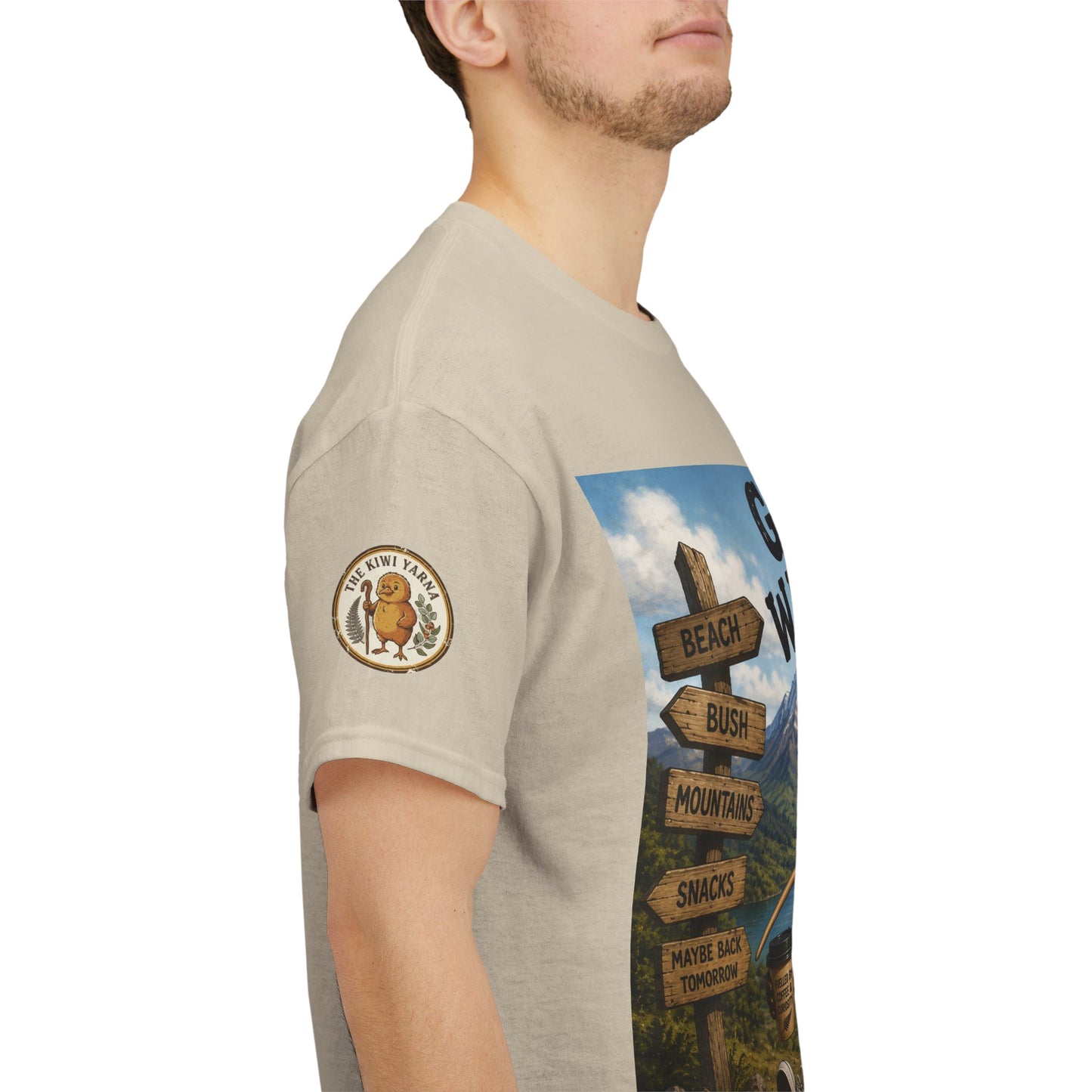 Natural T-shirt with circular sleeve logo patch and vertical “Gone Walkabout Kiwi Style” artwork.