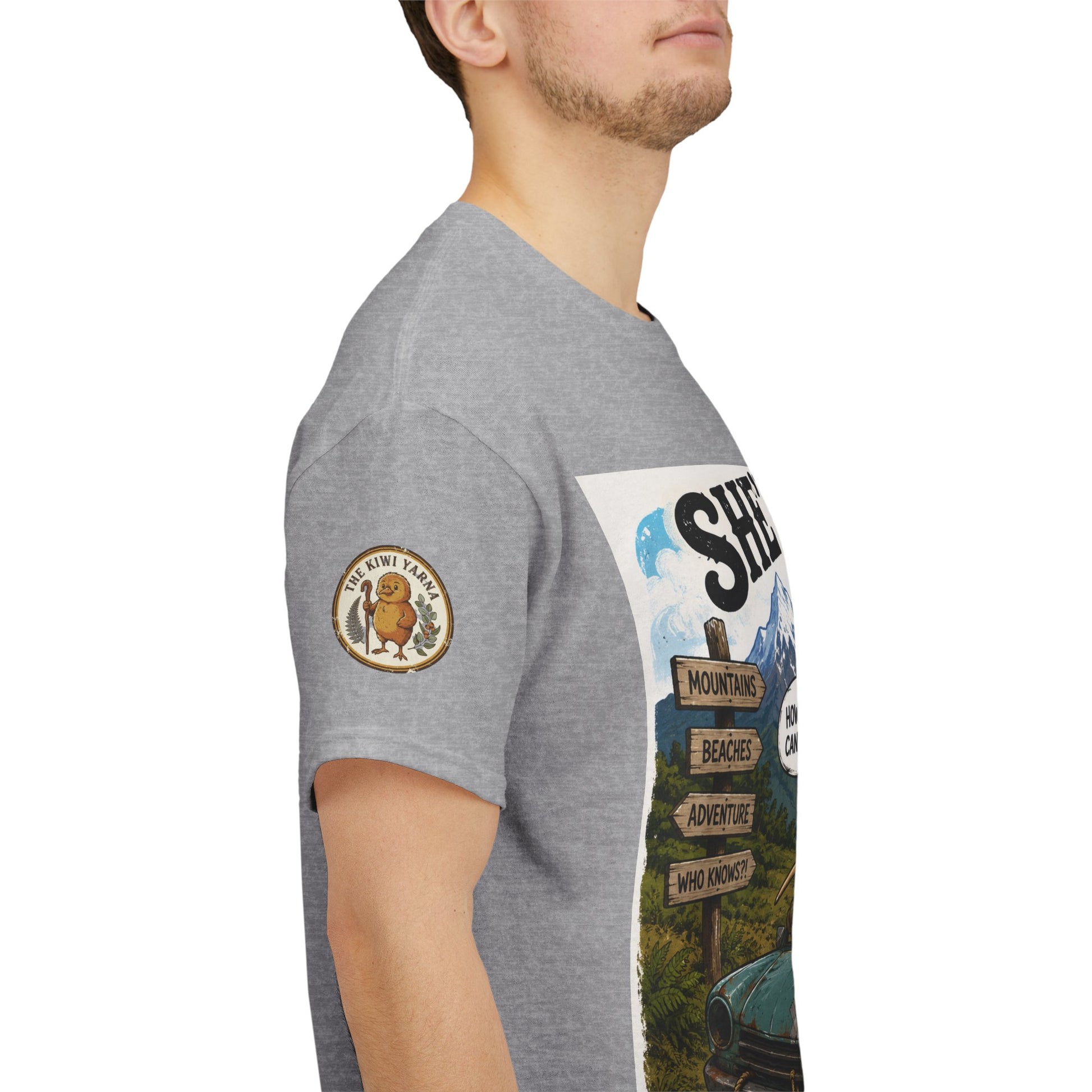 Grey T-shirt side view with circular chest patch and partial front graphic