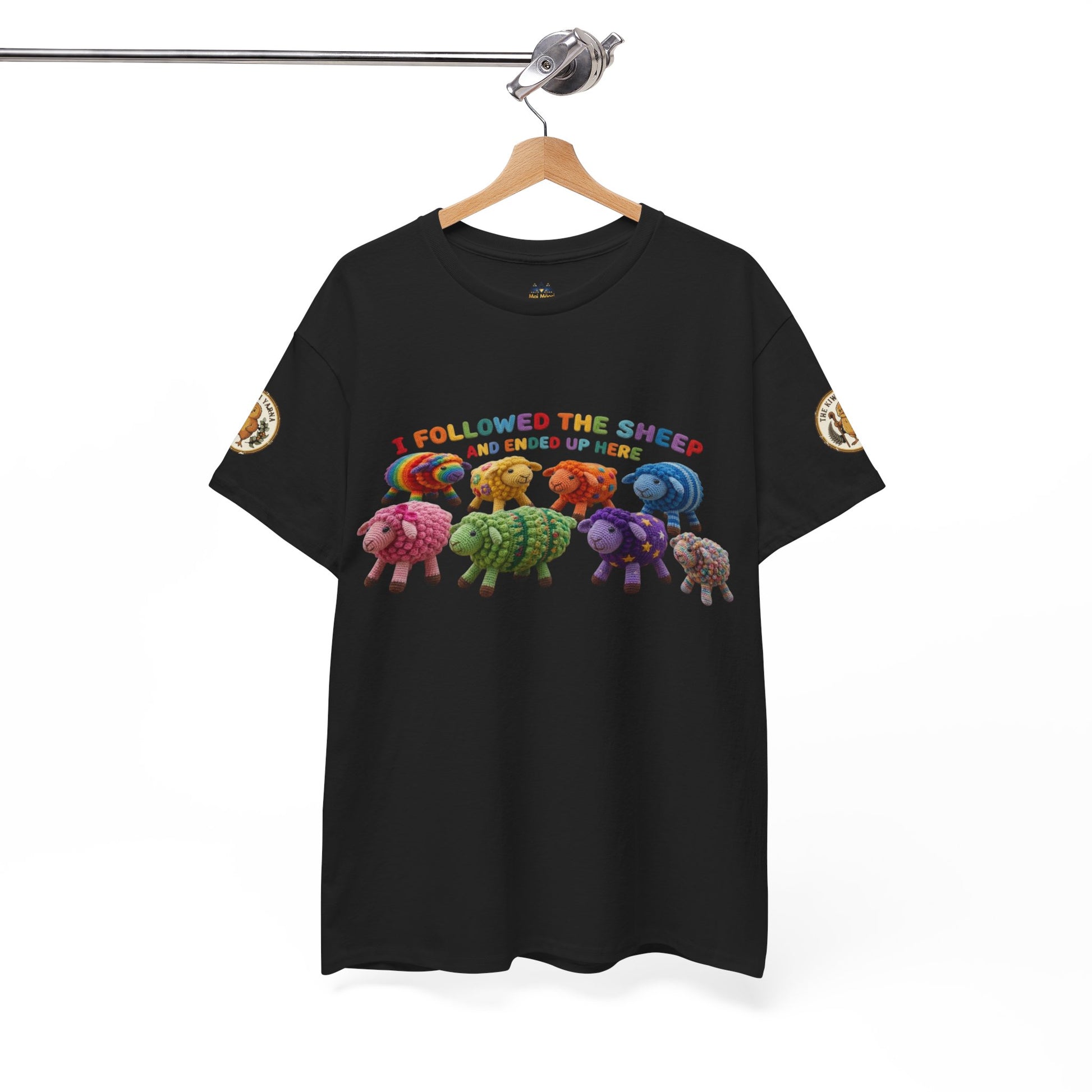 Black T-shirt on hanger with colorful sheep graphic and gold sleeve patches