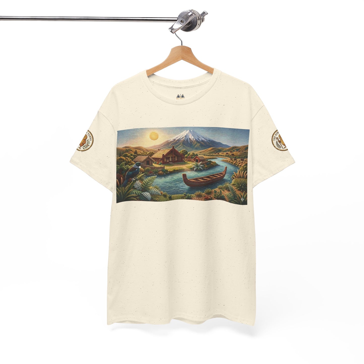 Unisex cream T-shirt with landscape graphic panel and sleeve emblems.