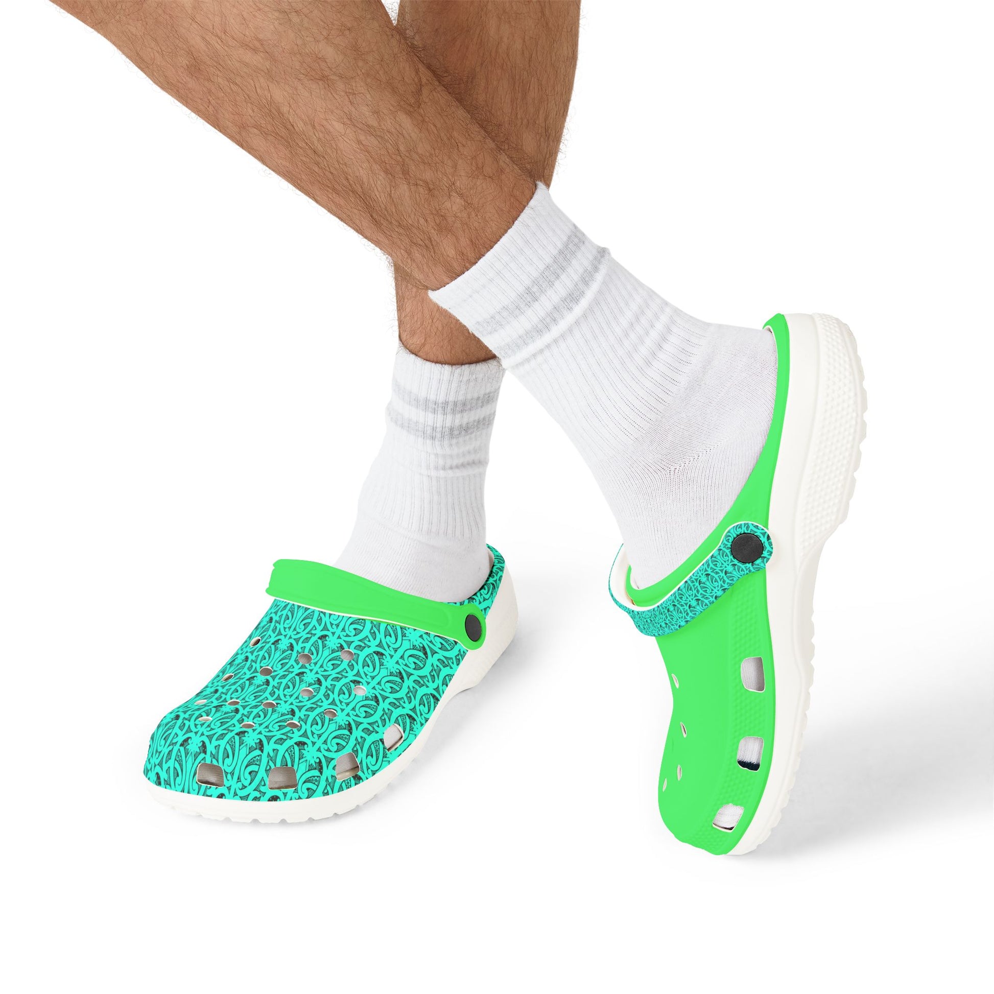 Neon green and teal clog sandals worn with white socks on feet