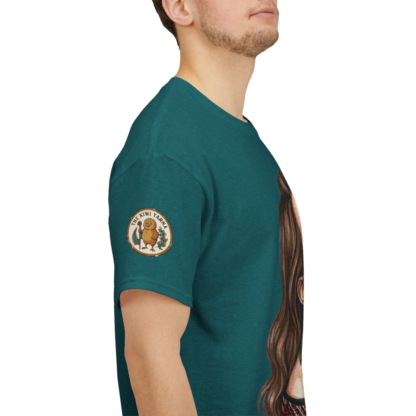 Teal graphic T-shirt with circular chest patch and partial portrait print on sleeve