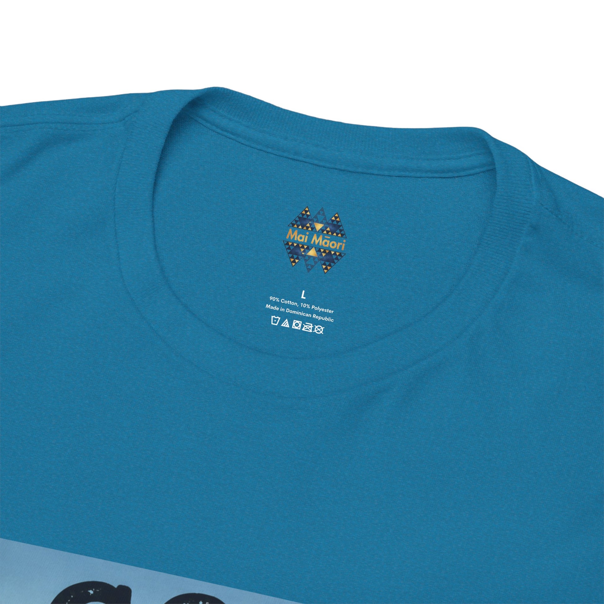 Blue crewneck T-shirt close-up of small chest logo at the neckline.