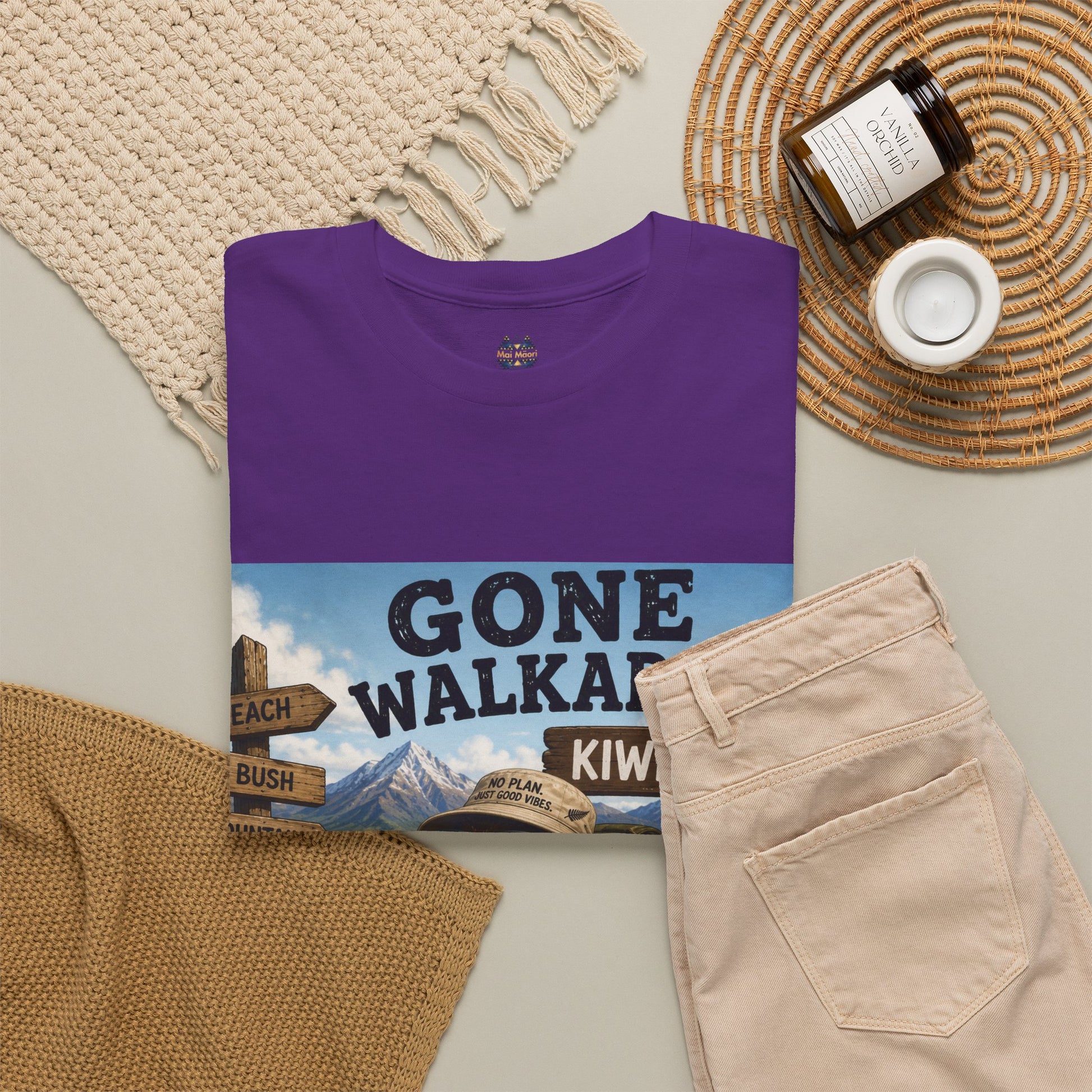 Purple crew-neck short-sleeve T-shirt with front graphic print and small chest logo.