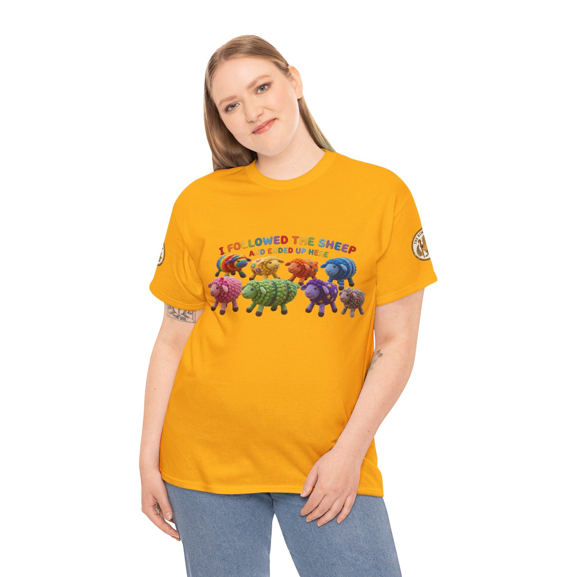 Yellow crewneck T-shirt on model, featuring colorful sheep herd graphic and printed text.