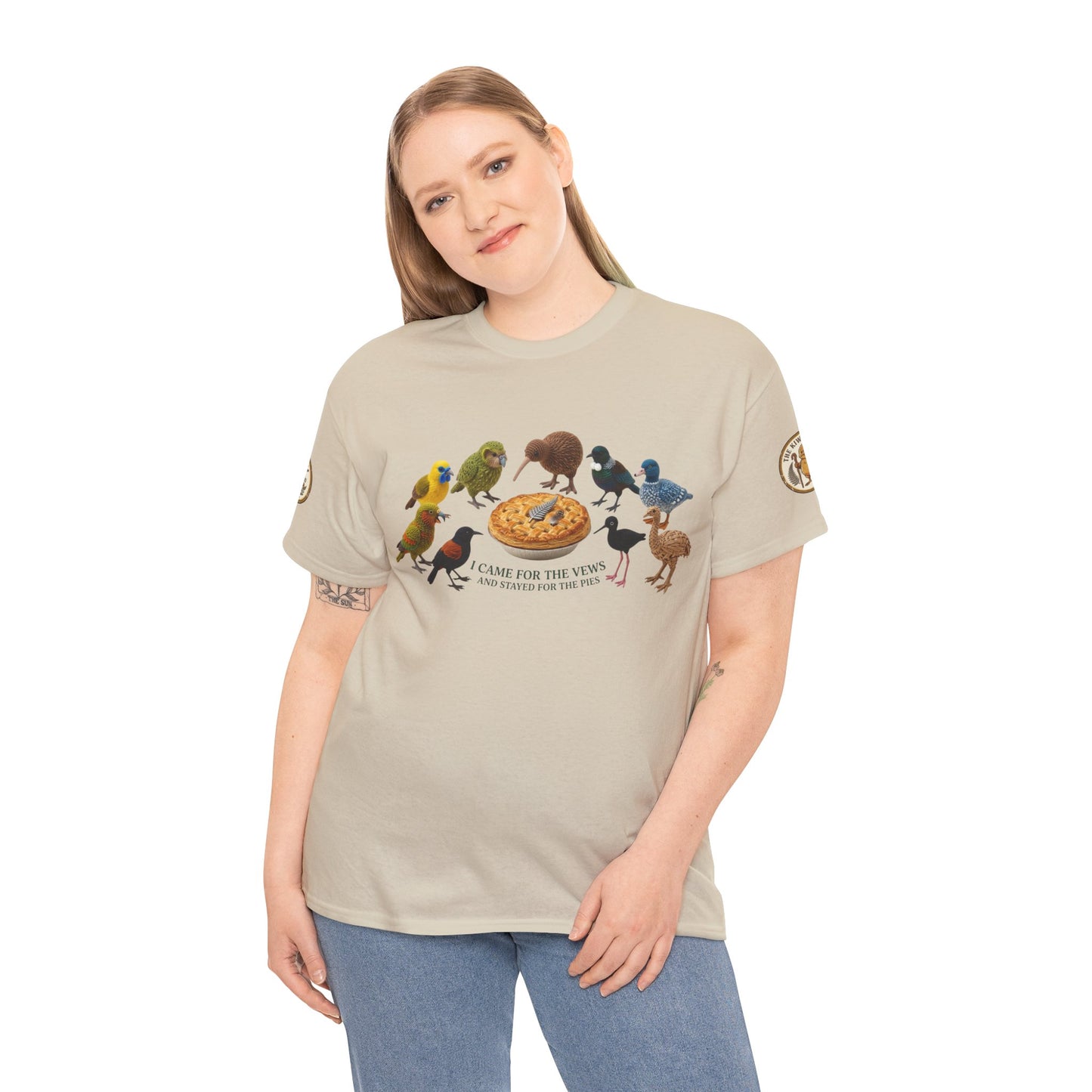 Natural short-sleeve T-shirt on model, front shows colorful birds and pie graphic.