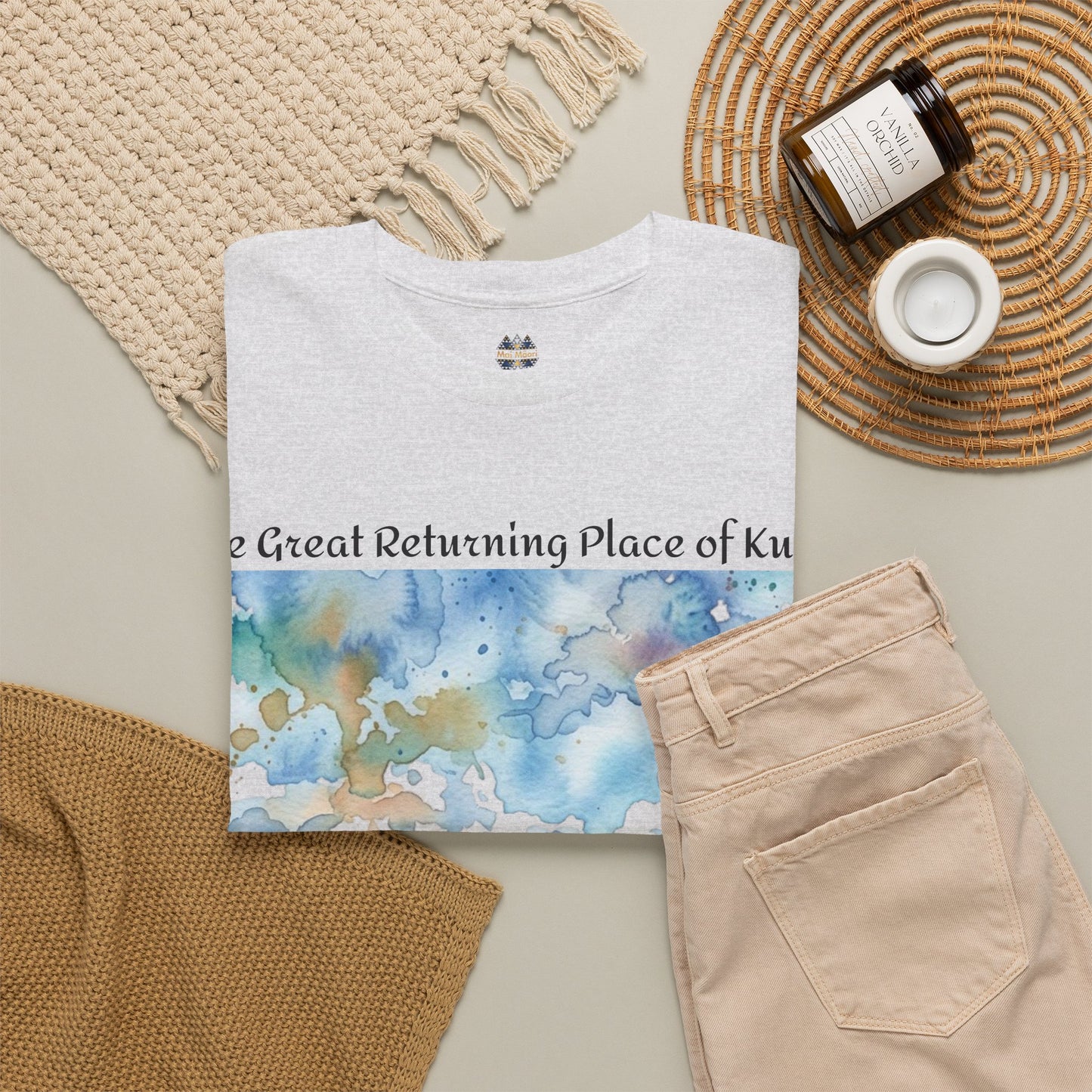 White graphic T-shirt with watercolor landscape panel and small chest logo